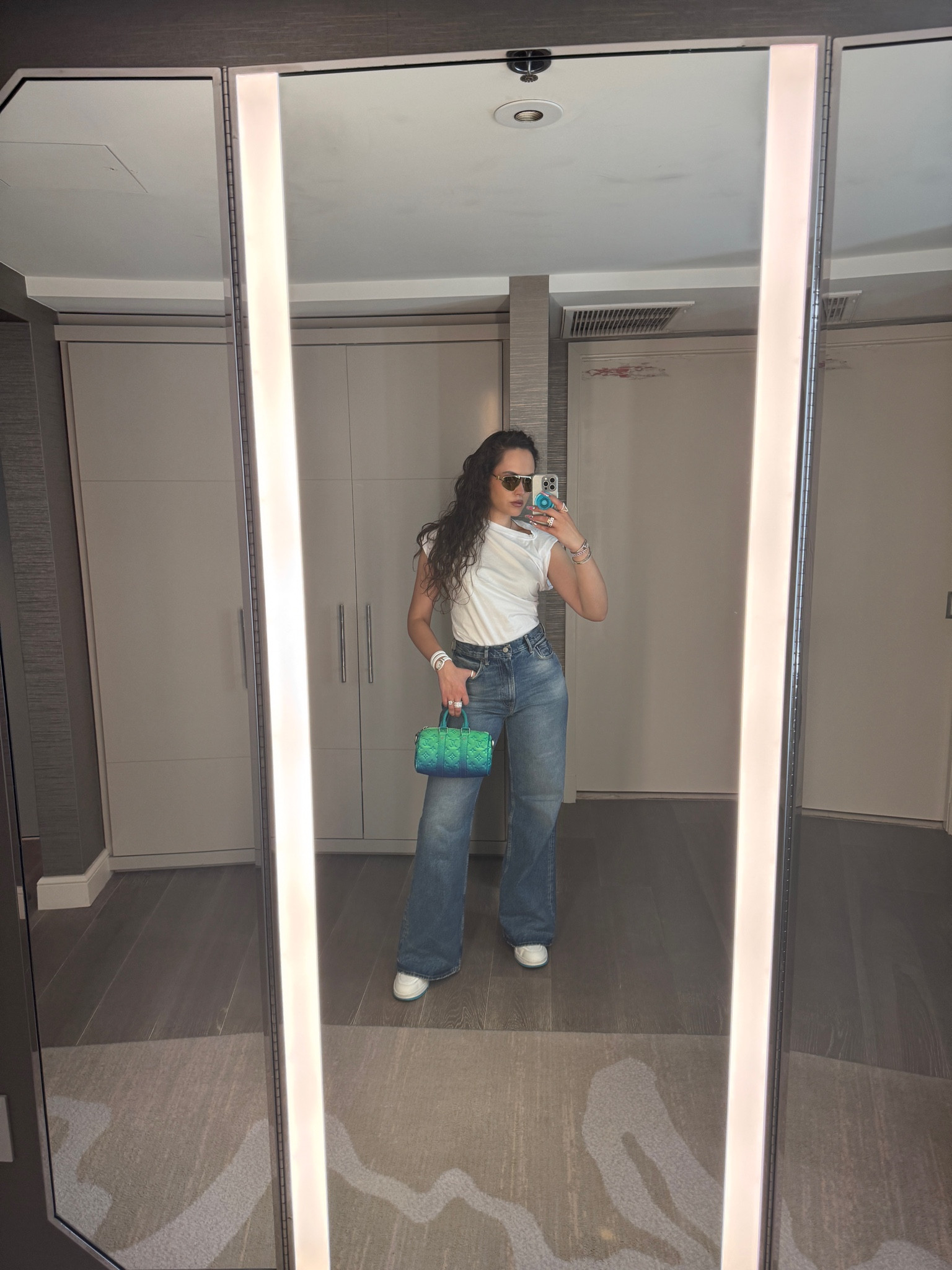 White no sleeve short sleeve top, blue jeans, white trainers, sunglasses, LV bag

#LTKSeasonal #LTKstyletip #LTKeurope