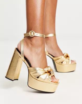 ASOS DESIGN Natia knotted platform heeled sandals in gold | ASOS (Global)