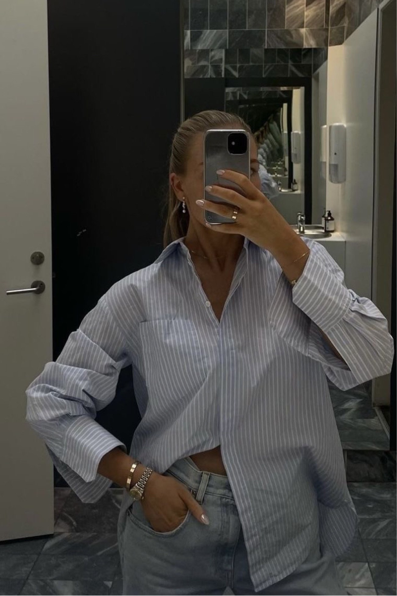 Oversized blue and white striped button down with jeans | 2024 spring outfit inspo 

#LTKfindsunder50 #LTKsalealert #LTKSeasonal