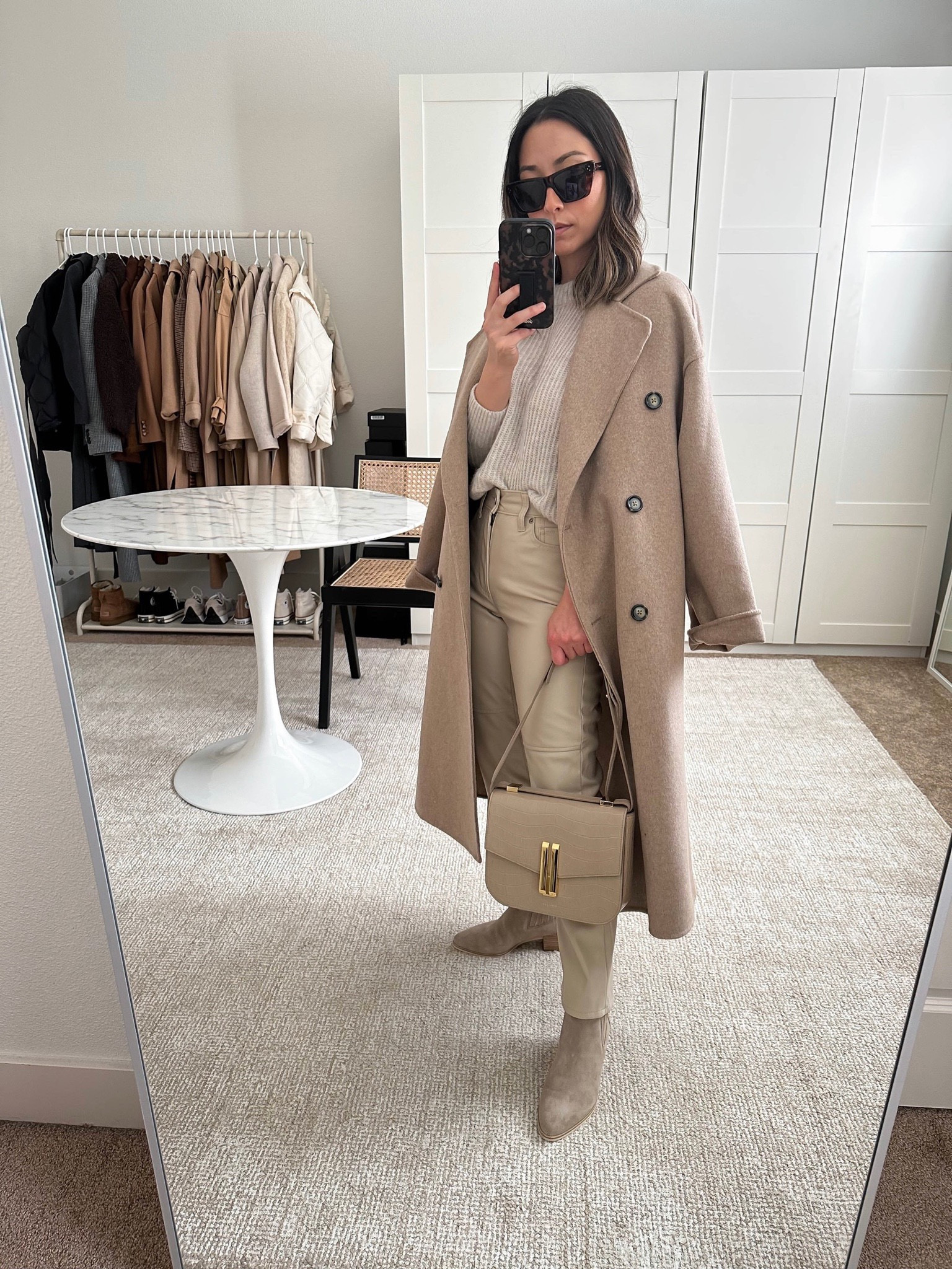 Taupe tonal outfit. Love this Mango coat. Runs very oversized - size down. But, it’s stunning! These Vince booties are a great neutral color option. They run TTS

Coat - Mango xxs
Sweater -  Everlane xs
Pants - Gap petite 26
Booties - Rag & Bone 5
Bag - DeMellier 
Sunglasse - Celine 

Tonal style. Neutral capsule wardrobe. Petite neutral outfit. Faux leather leggings outfit. 

#LTKunder100 #LTKshoecrush #LTKitbag