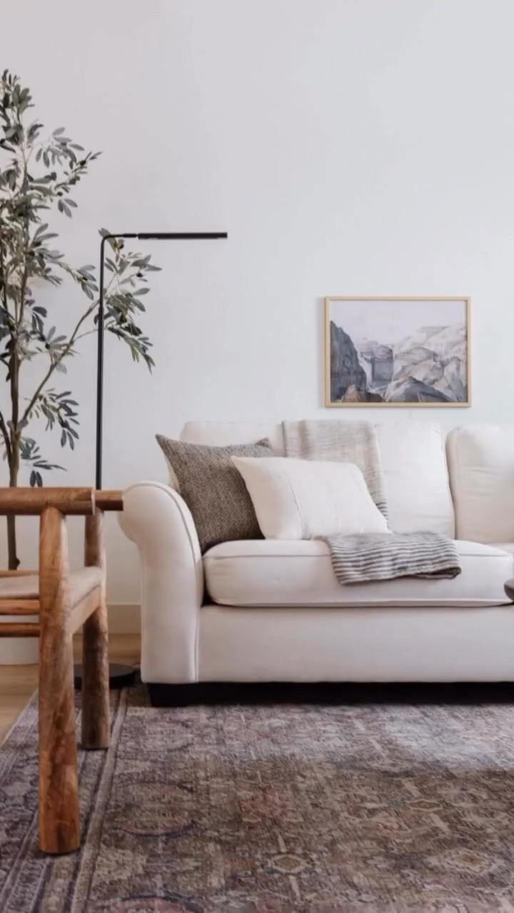 This #ProjectMeadowbrook living room was one of my very first projects back in 2019 (when PHI was in its infancy). It is a study in layers—creamy upholstery, textured pillows, and warm wood accents. The vintage-inspired rug grounds the space and adds just enough pattern to keep things interesting, while the neutral palette keeps it timeless.
 
But what really makes this room special is how it works double duty, but in a way that is practical and pretty. If you saw the before, you know this space was used by the previous owners as a catch-all “office”—utilitarian desks, bulky chairs, and way too many wires. It wasn’t cozy, cohesive, or particularly inviting, especially for a room right by the front door. By reimagining the layout and softening the materials, we transformed it into an elegant living room with a small office nook that feels completely at home in the design.
 
Now, the shelves display art, books, and a few collected pieces that make the space feel personal and curated, not “workspace first.” It’s proof that you can absolutely have function and beauty… and that your office doesn’t need to look like, well, an office.
 
Design // @peggyhaddadinteriors 
Photography // @karadeyoung 

#LivingRoomIdeas #HomeOfficeDesign #BeforeAndAfter #LayeredInteriors #PeggyHaddadInteriors