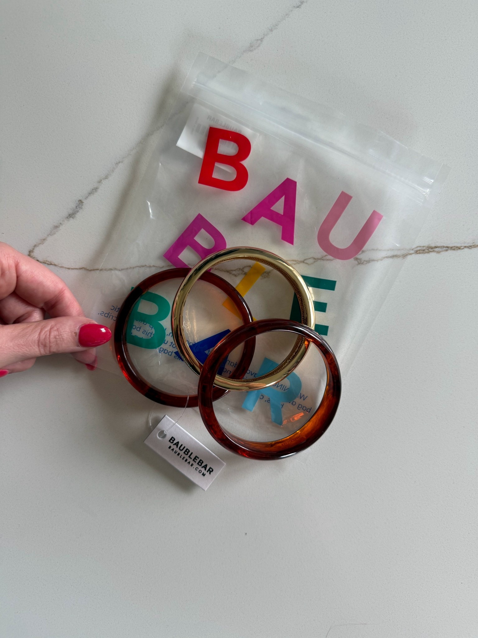 Obsessed with these bangles from BaubleBar! New from their spring line. 

#LTKSeasonal #LTKgrwm #LTKootd