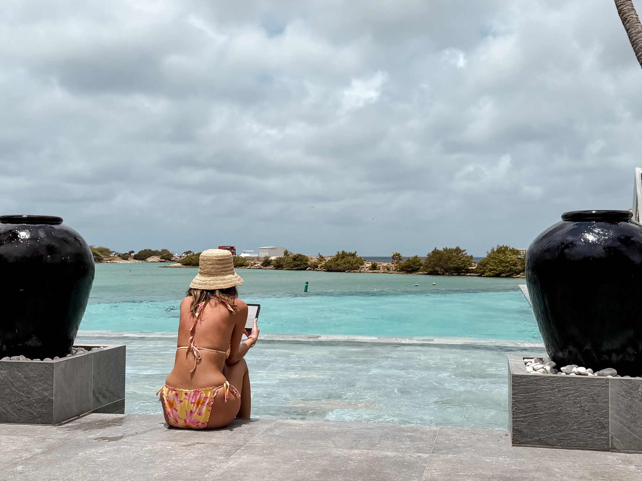 Target swimsuit and yellow floral bikini 
Kindle paper white and l*space bucket hat
Straw woven hat for summer and pool days on vacation 