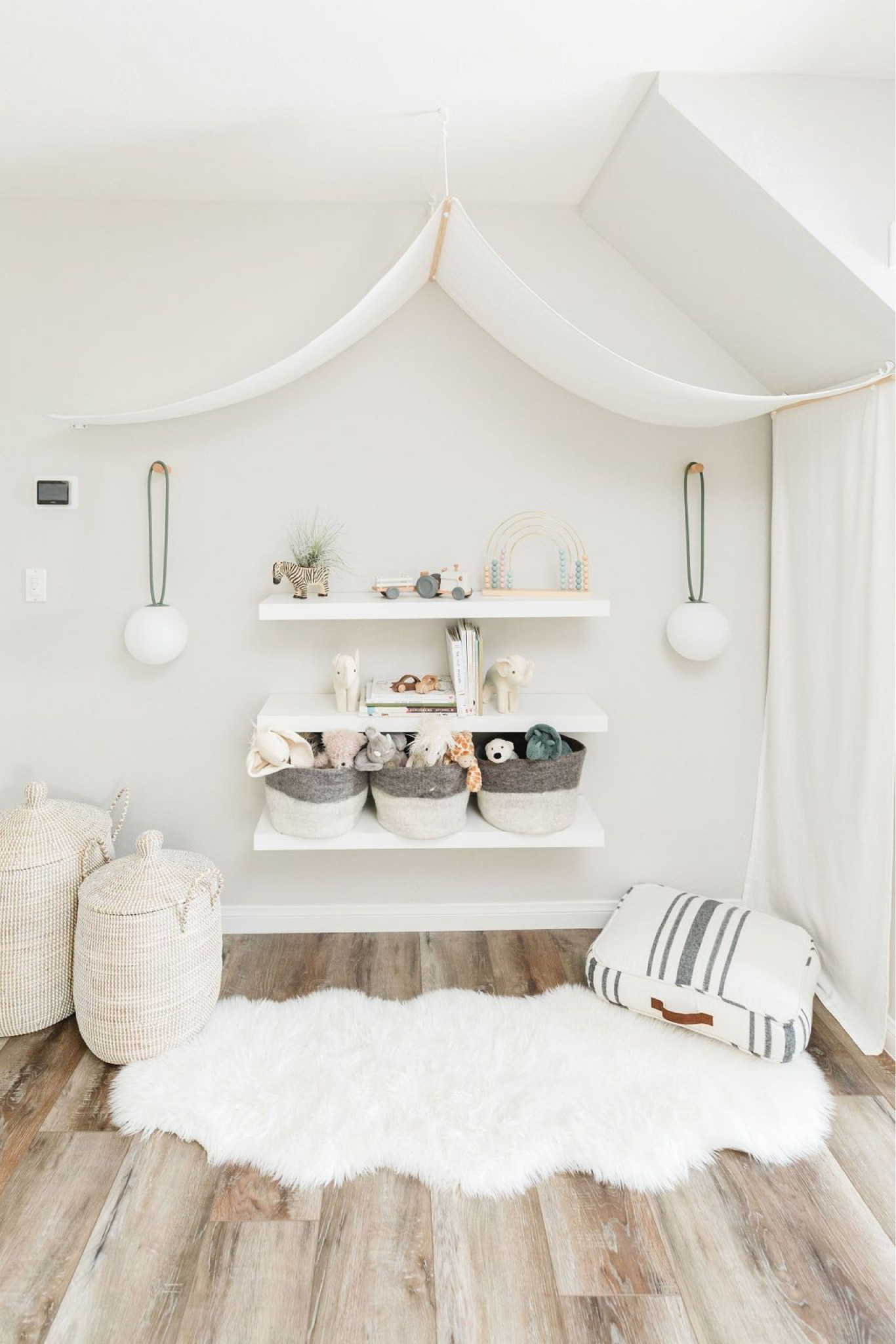 Bright and airy kids playroom with floating shelves and storage bins. 

Shelves, pendant lights, storage bins, plush toy, cushions, baskets. 

#LTKkids #LTKhome #LTKunder100