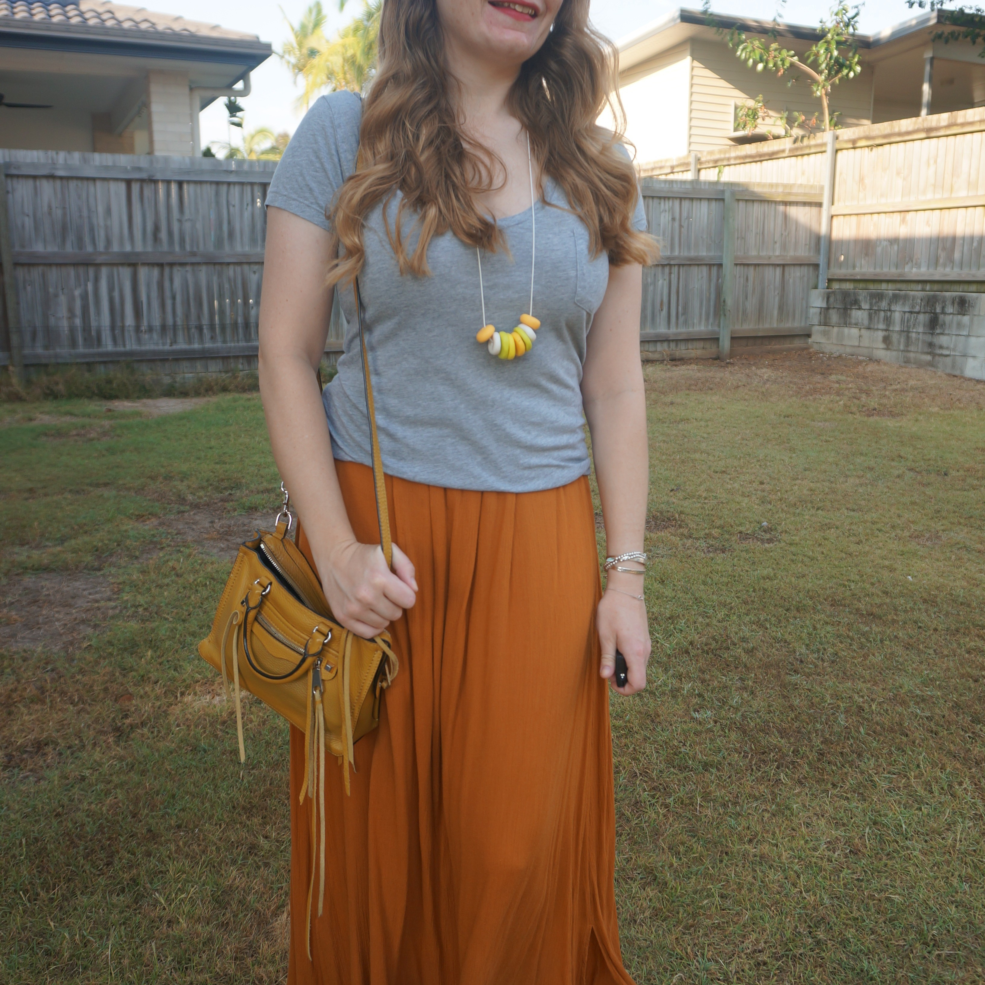 Orange maxi skirt with grey tee and yellow accessories like this Rebecca Minkoff micro Regan bag 💛🧡

#LTKbag #LTKspring #LTKaustralia