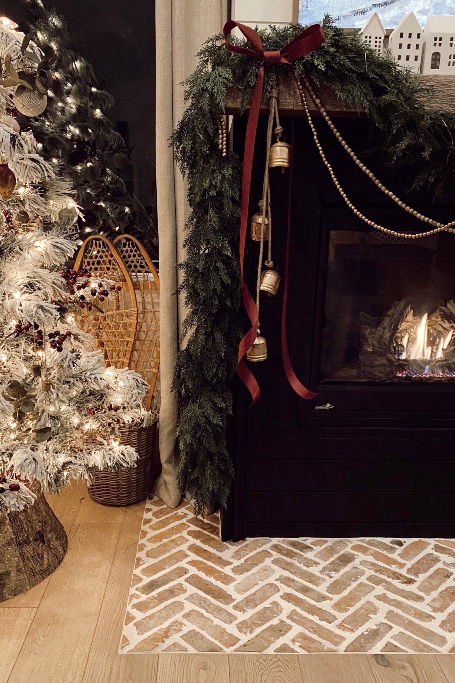 Mantle Reveal | the houses add such a softness to this classic look. 
Christmas bells, gold beaded garland, faux garland, white ceramic houses, winter art, flocked Christmas tree