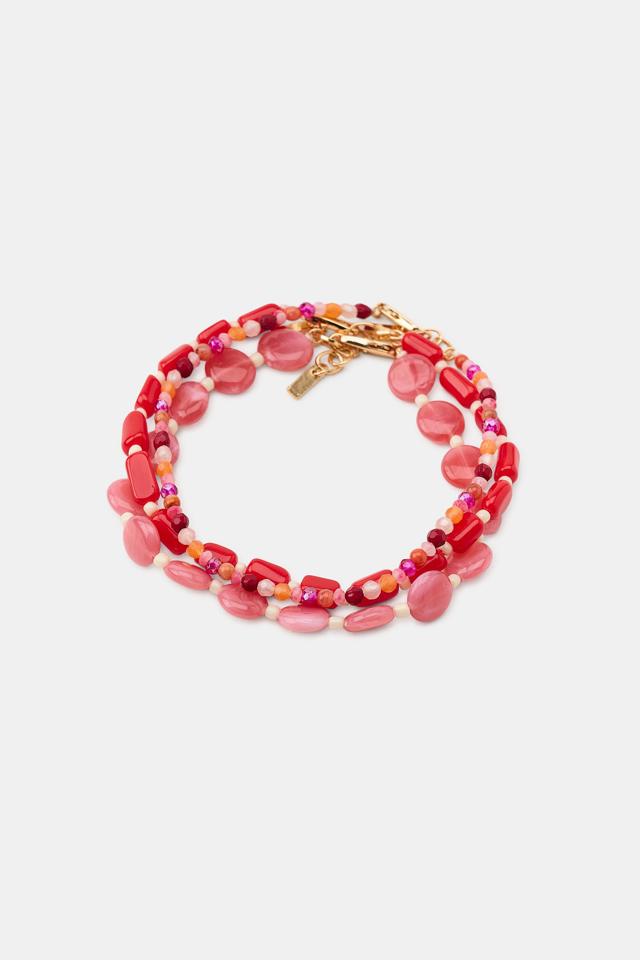 Le mannequin mesure : 169 cmLot de trois bracelets de cheville m\u00e9talliques avec application... | Zara FR