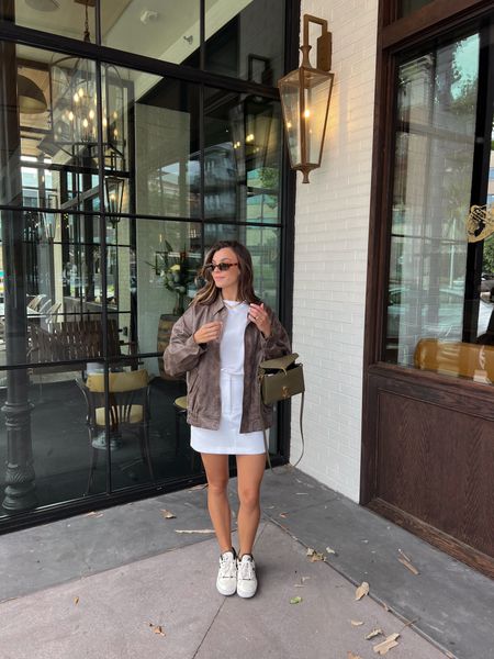 Headed to the maverick game! Wearing a small in the tee, skirt, and jacket— my fav basic tee lately! 

Amazon sunglasses, green new balances, ysl bag 