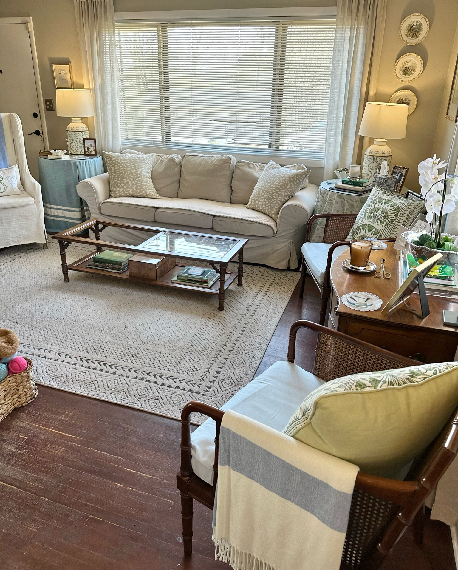 An overview of our living room from the hallway!

Our living room so far feels pretty finished, but there are still some updates I’d like to make! Here’s a look at how it looks now to give you an idea of the space we’re working with and the different vignettes set up in the room!

First house, living room, blue and green decor, southern traditional, antique furniture, smaximalist, southern maximalism, affordable home decor, interior design hack, cane furniture, faux bamboo furniture, ikea sofa, skirted table

#LTKfindsunder50 #LTKhome #LTKfindsunder100