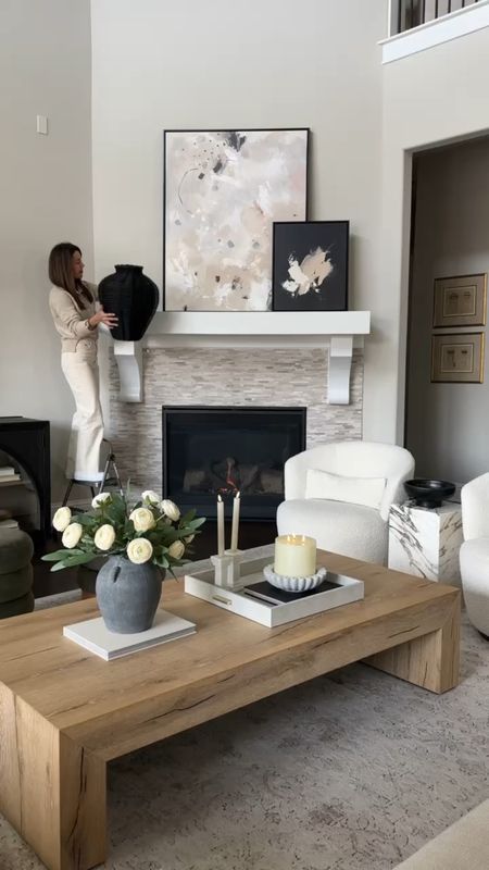 I refreshed my living room fireplace mantel with these beautiful and realistic leafy greenery! Also my hand woven vase is on sale!! My abstract art, coffee table, best selling area rug, and everything as seen here is linked. Including the coffee table decor! 4/18

#LTKhome #LTKstyletip #LTKVideo