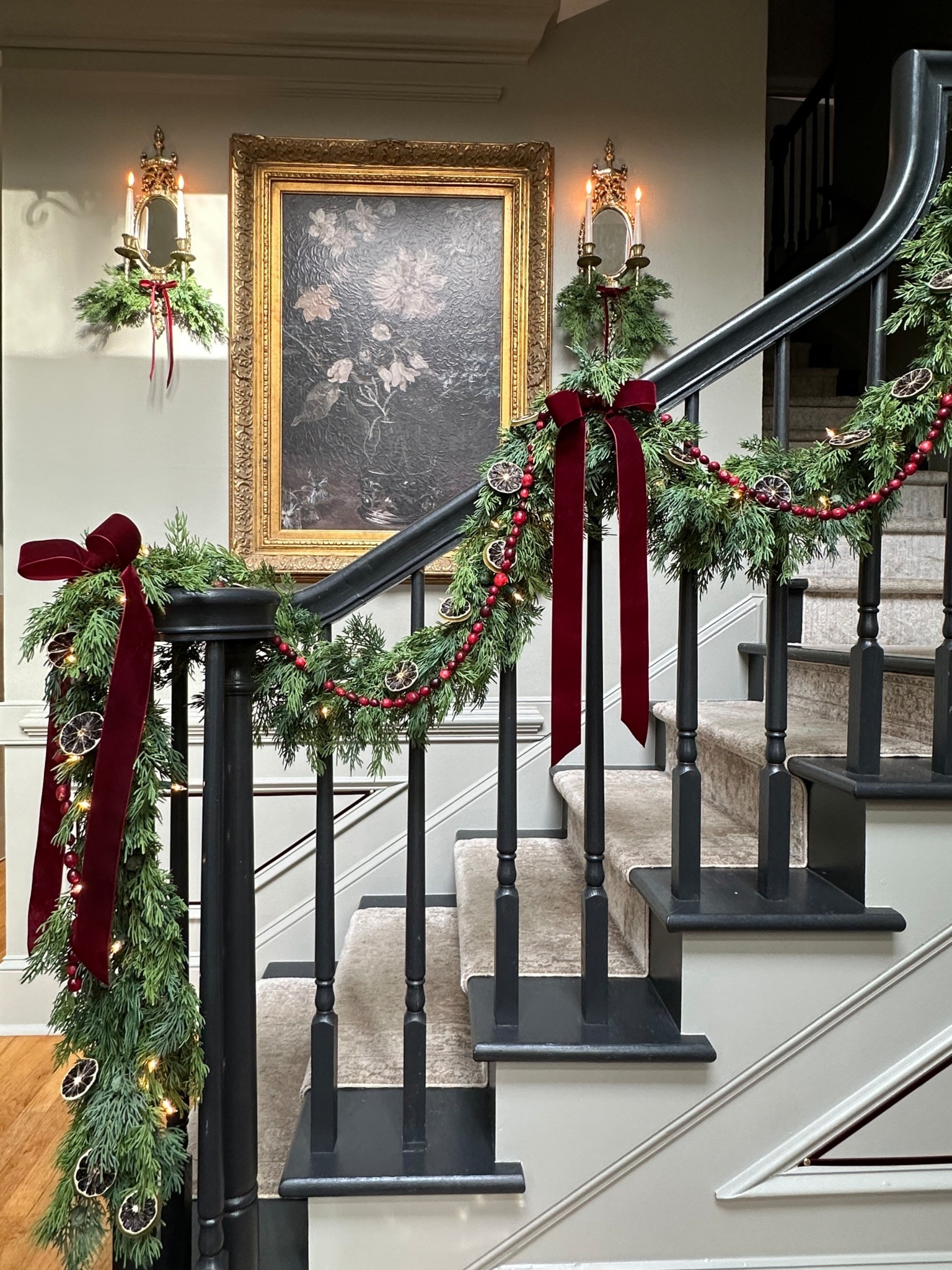 Last year's entryway was all dressed up for the holidays! I'm planning a similar Olde World Christmas theme this year with a few new additions 😍
Faux cedar garland, twinkle lights, and burgundy velvet bows with a fresh cranberry garland.
You can see the greenery swags I added to the sconces in the background, tying it all together. Everything’s linked here to shop the look! 

 

#LTKHoliday #LTKSeasonal #LTKHome