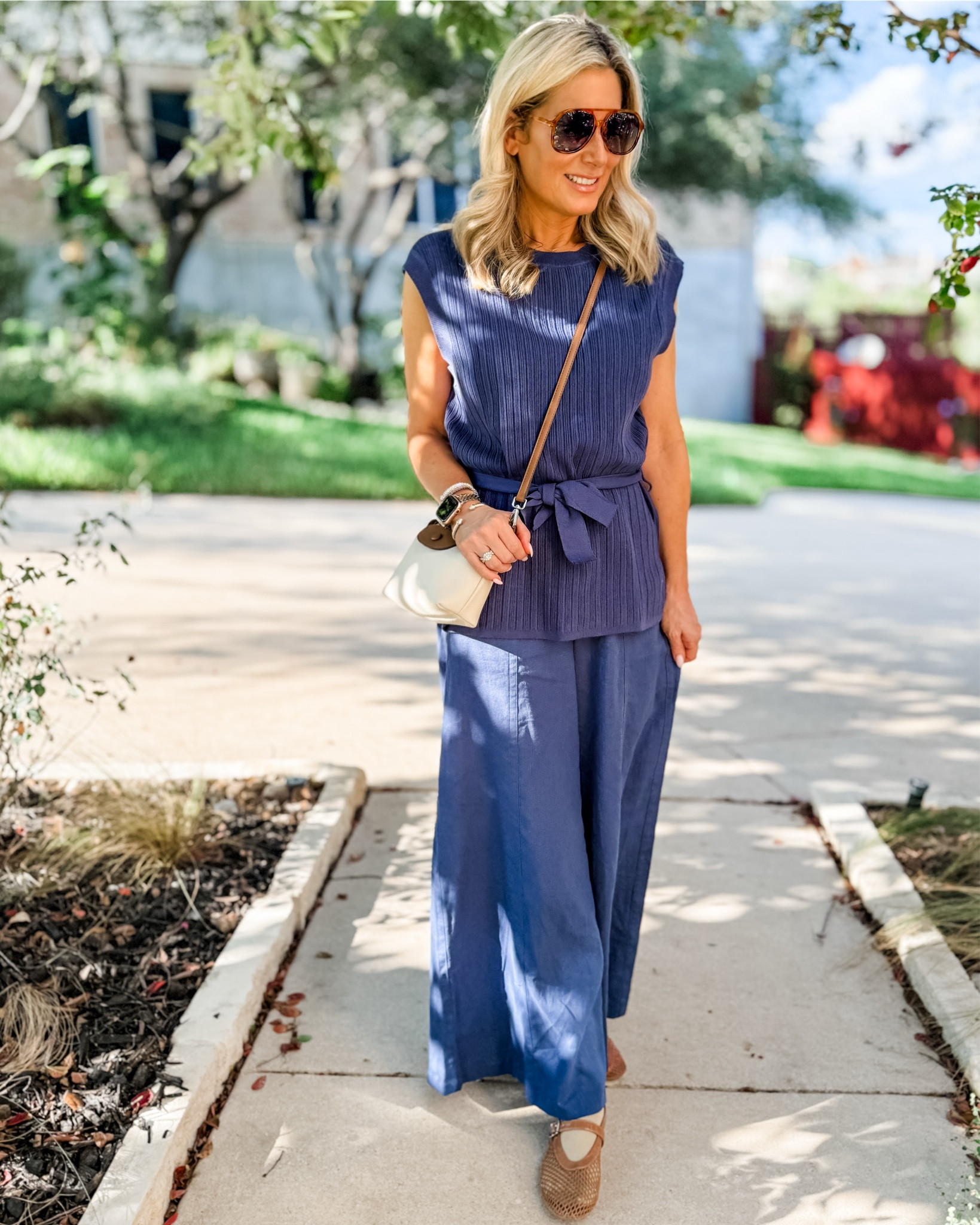 This might not be what comes to mind when you’re considering a work from home outfit, but it’s so comfortable. The knit top is a longer, looser fit and the linen blend pants are a pull on style. I just grabbed some slip on shoes and my current go to crossbody to make a run to the grocery store and felt great.  WFH doesn’t have to mean loungewear and sweatpants but can be just as comfortable!



#LTKWorkwear #LTKFindsUnder50 #LTKOver40