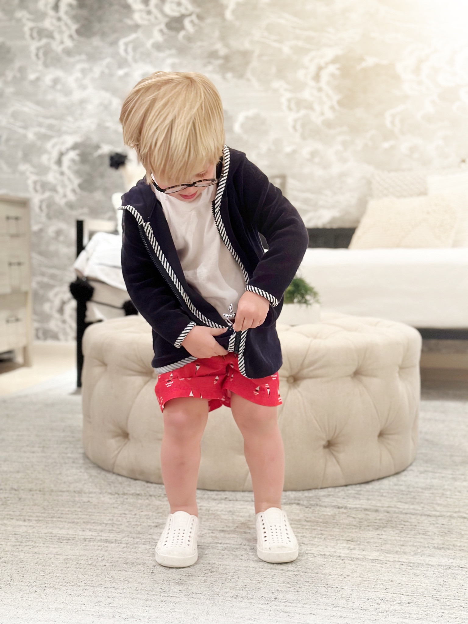 Who is ready for swimming lessons?! 💦
Boots was very proud of his Terry zip up robe this morning. Zipper and two pockets- what could be better?! 
Everything he has on was a hand-me-down from big brother but it’s all still online! 
We get new white rubber natives each year and they take us far- swimming lessons, the beach, rainy days… the kids love them because they have no laces. 

#LTKswim #LTKshoecrush #LTKkids