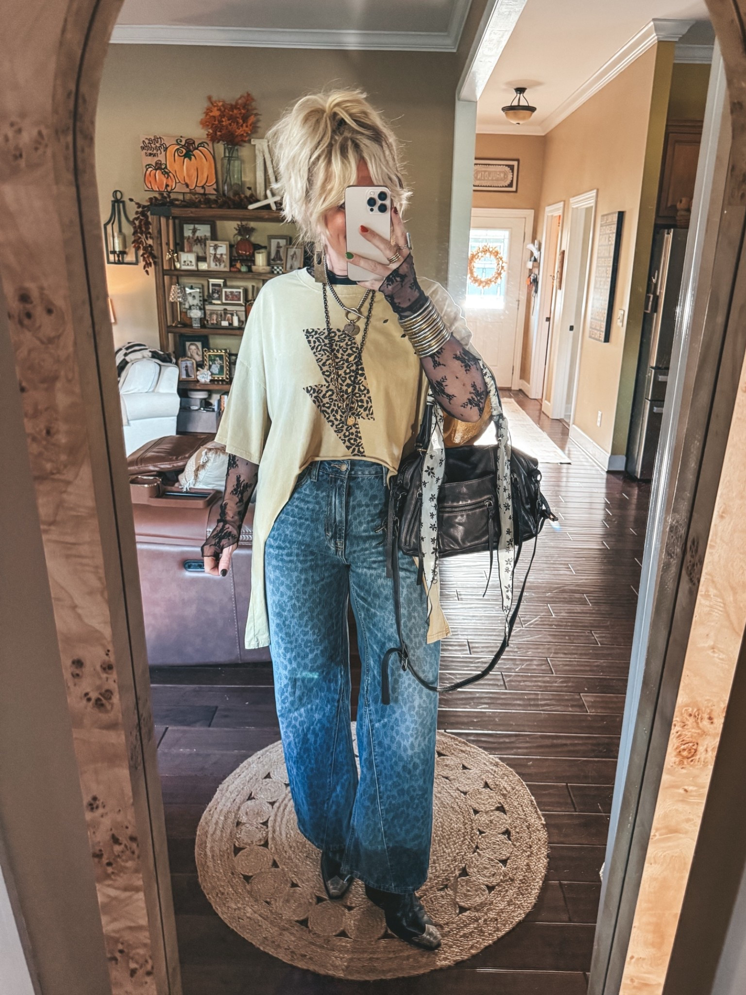 Such a fun way to cut an oversized tee and I love these adorable jeans from Target! A mesh top is a closet staple too. I absolutely love mine! 👏🏼👏🏼
•Tee older and an oversize size medium (linked same brand in a peace sign) 
•Jeans are true to size 
•Mesh top is Free People and a size large. I did size up for a more comfy & not tight fit. 
•Boots are true to size 
✨My Twisted Silver necklaces & earrings I can’t link here but save there with code MANDIE20

#LTKootd #LTKgrwm #LTKOver40