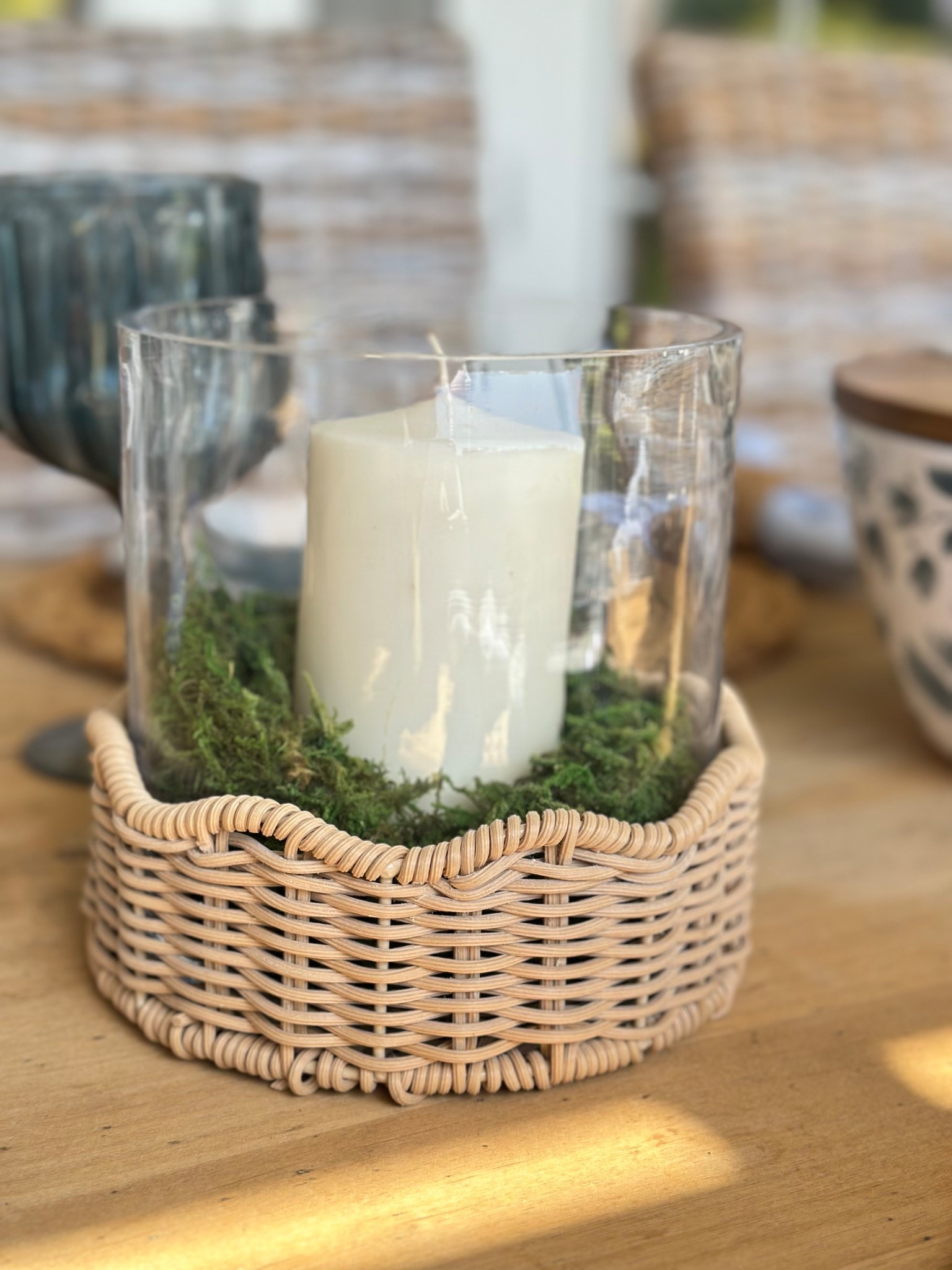 I am loving these scalloped woven hurricane candle holders!

I used them on my back patio dining table and added some moss and pillar candles.

They are the perfect centerpiece and will be beautiful with the candles lit for an evening dinner on the patio. 

These glass hurricane candle holders would even be beautiful used as a vase for fresh flowers. 

#LTKFindsUnder50 #LTKHome #LTKStyleTip