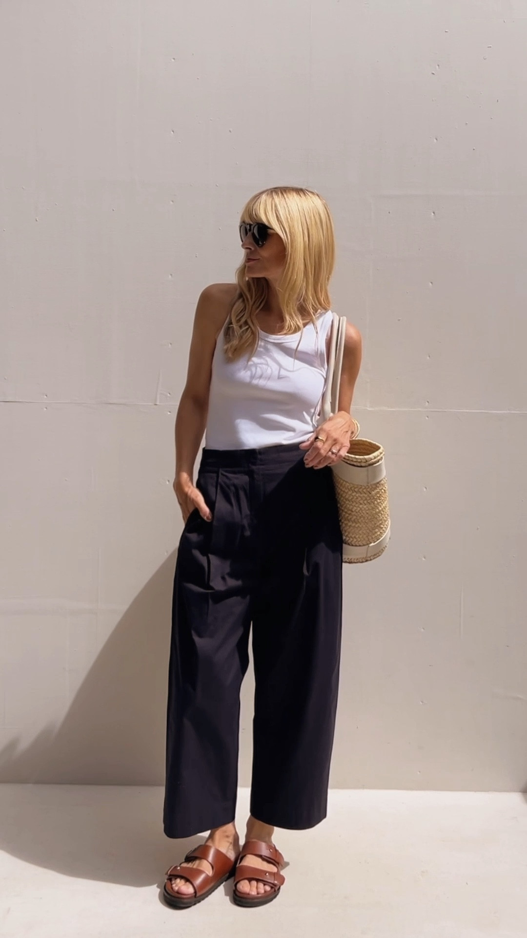 White tank top, black trousers, straw beach tote bag, brown open toe sandals 

#LTKeurope #LTKHoliday #LTKSeasonal