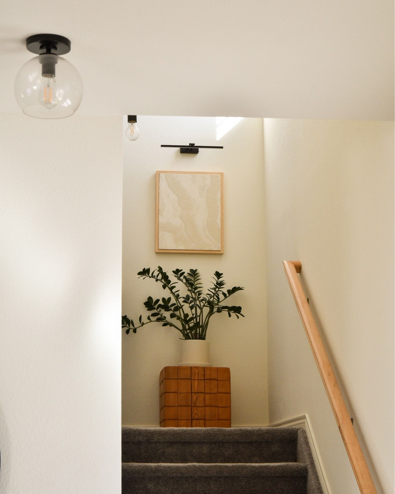 Stairwell view with our new picture light! 

#LTKhome