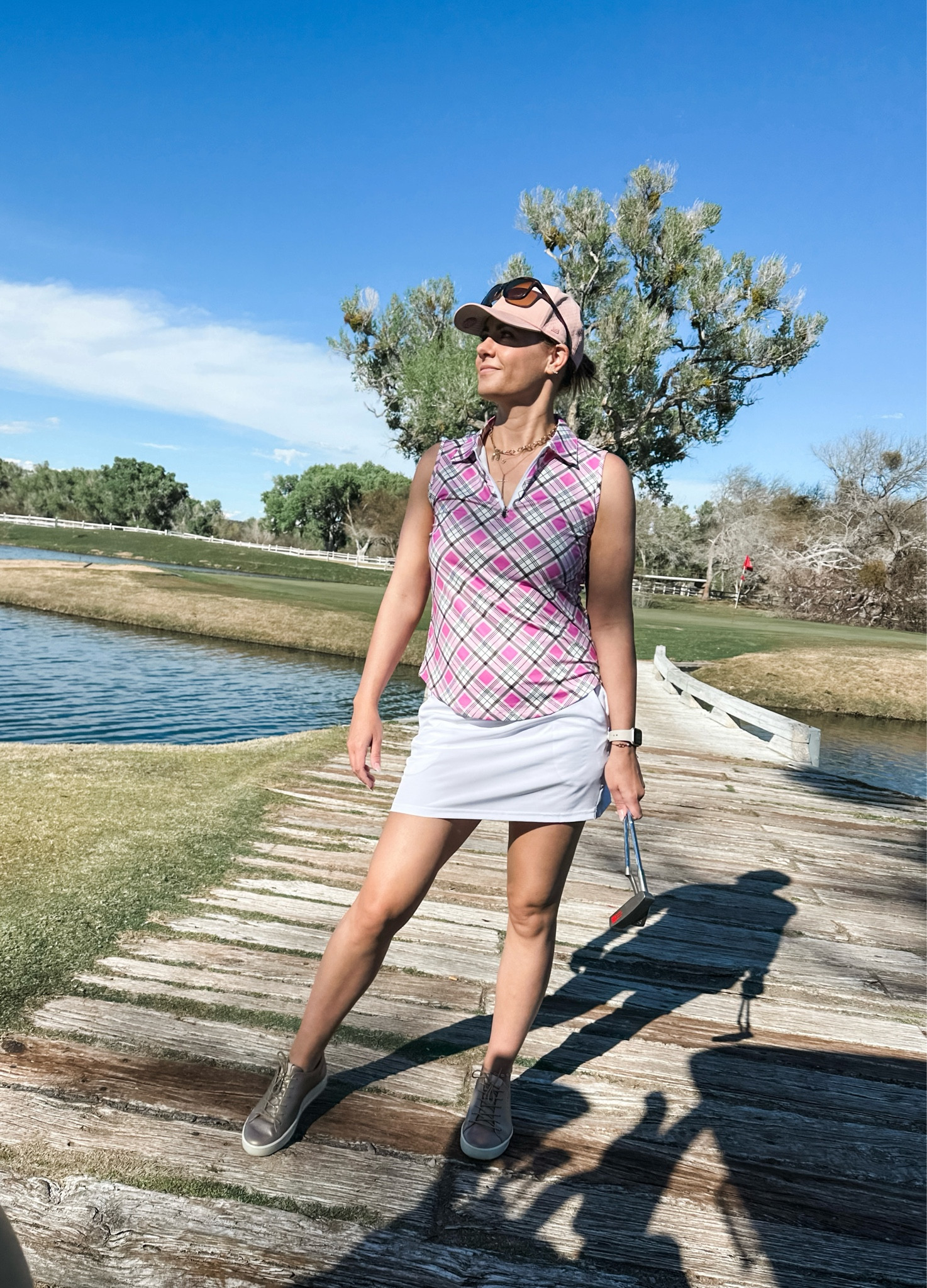 Women’s golf outfit from Amazon ⛳️// gold polo, golf sleeveless polo, white athletic skirt, rose gold golf shoes, pink baseball cap, melin hat, Oakley sunglasses

#LTKstyletip #LTKfindsunder50 #LTKfitness