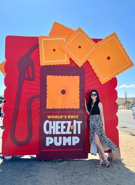 I went to the Cheez-It Pump in Joshua Tree! It was gloomy and raining in San Diego but I knew it was going to be hot inland. I wore my zebra satin slit midi skirt with a v neck sweater vest and black strappy kitten heels for the occasion. I wish I knew just how much sand and gravel there would be prior because I would have worn more appropriate shoes.

#LTKunder100 #LTKshoecrush #LTKFind