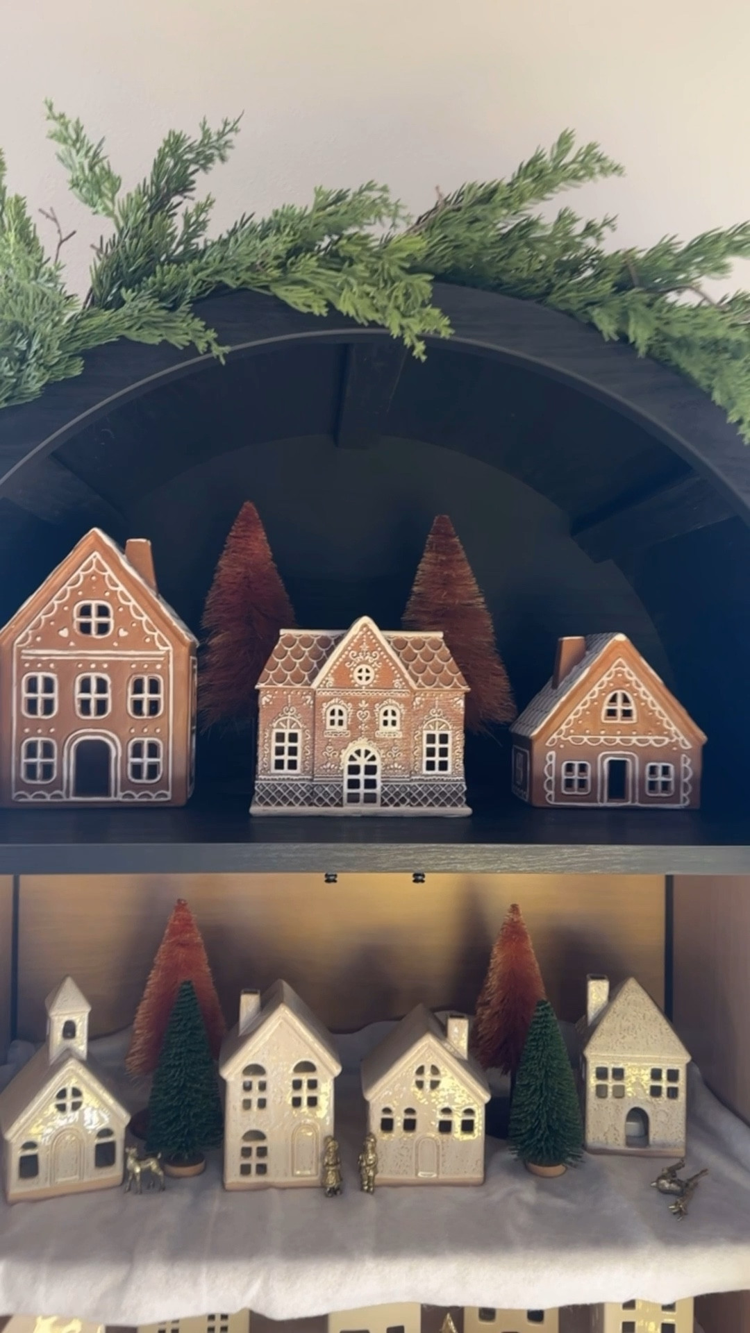 Arched cabinet Christmas village! 

White ceramic houses, gingerbread houses, bottle brush trees, brass figurines, garland , faux snow blanket 

#LTKStyleTip #LTKSeasonal #LTKHoliday