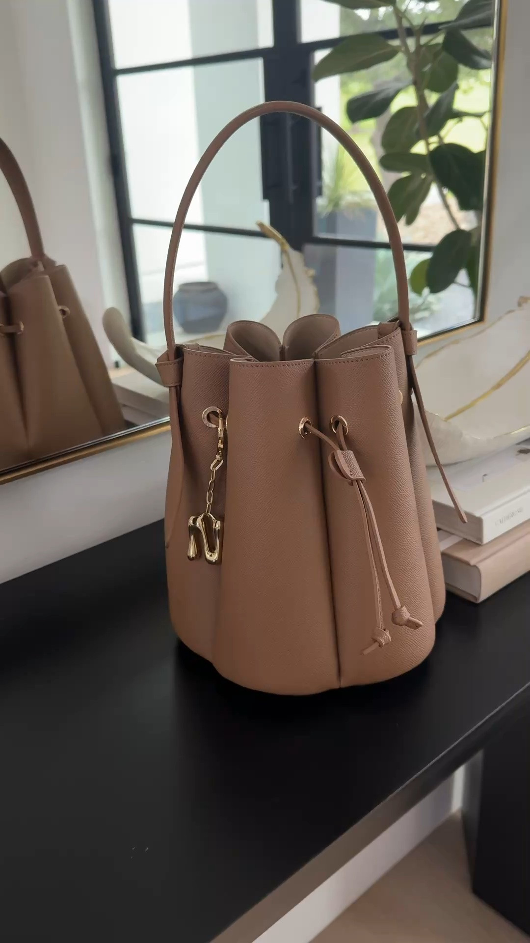 This under $100 bucket bag is so stunning and looks so designer! Code NASREEN20 gets 20% off $100+ purchases through tomorrow!!

#LTKootd