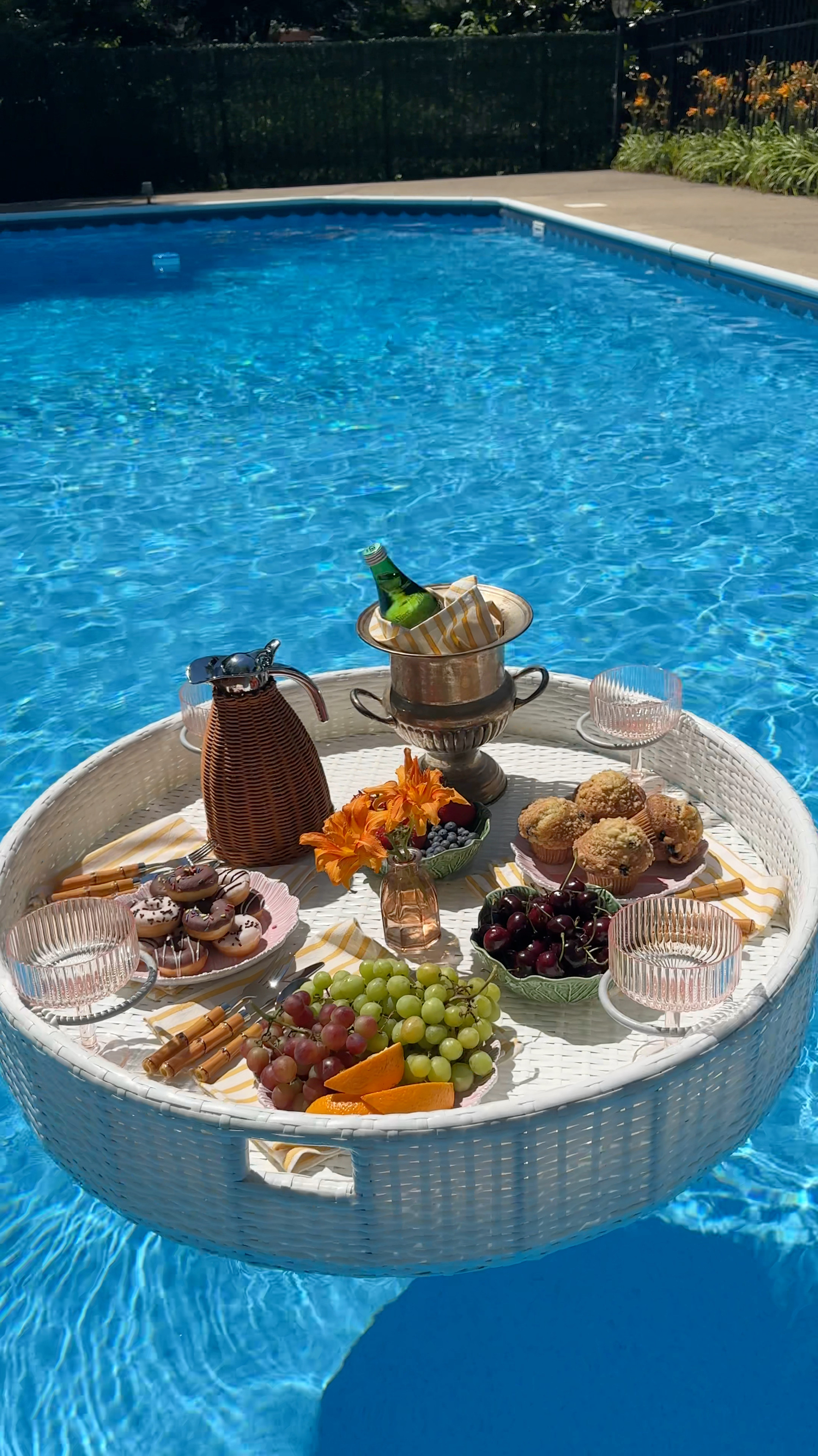 How to style a floating pool brunch tray with a champagne bucket, fresh fruit, rattan accessories, and ribbed glassware. Everything is shoppable so you can recreate the full setup at home. Click through for all the links. 

 #LTKSeasonal #LTKHome #LTKSwim