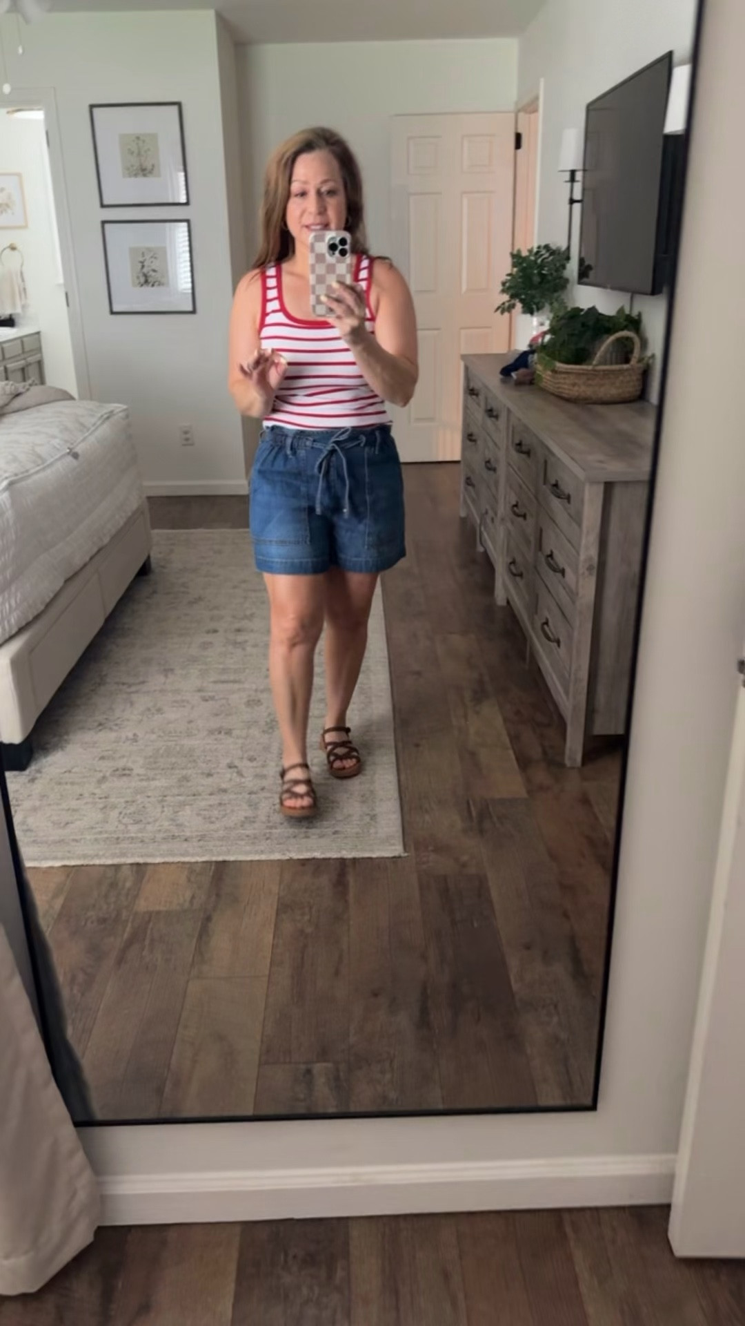 Summer outfit idea 
Perfect for the 4th of July and all summer 
Denim shorts 
Red white stripe tank 
Sandals 

I am in a small in top and Shorts, sandals TTS

#LTKPetite #LTKootd #LTKMidsize