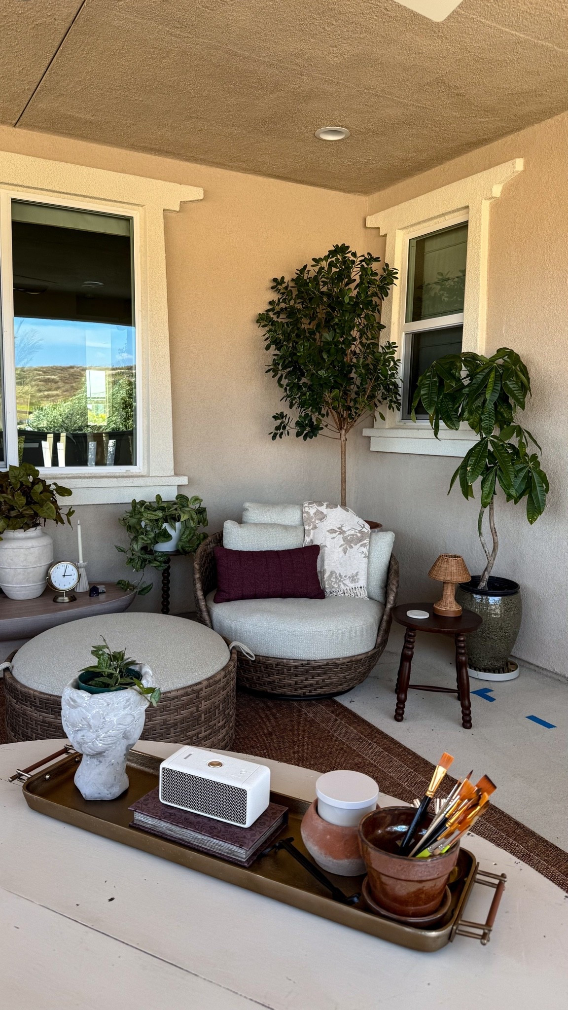 view of my cozy patio reading corner from my outdoor desk setup 

love this affordable outdoor lounge chair and ottoman! i’ve read two books in it since i got it

#LTKmorningroutine #LTKHome #LTKSeasonal