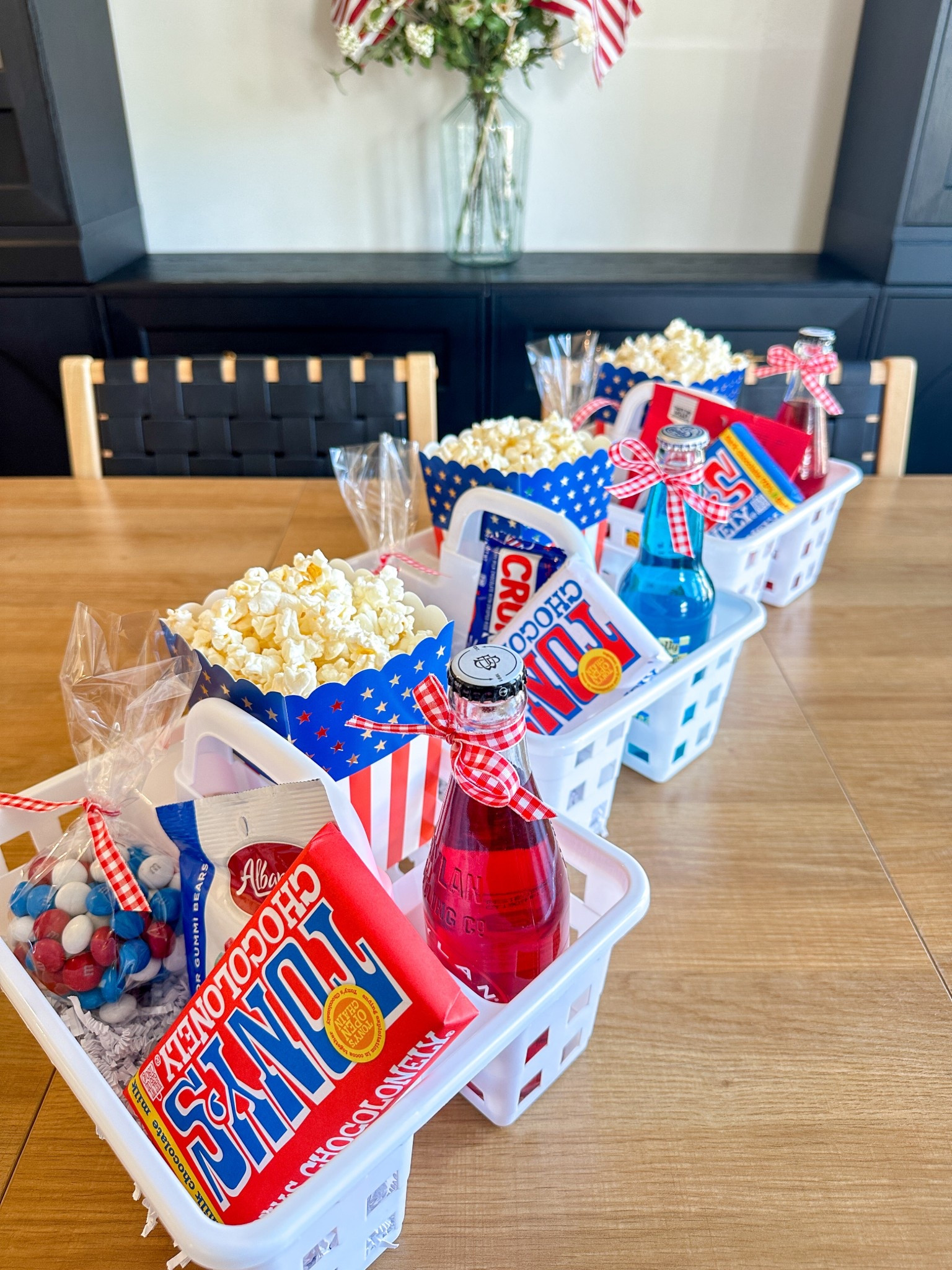 Hosting a 4th of July outdoor movie night? I found the cutest treat caddies at Dollar Tree that make serving snacks super easy and festive! Each one is filled with red, white, and blue goodies, keeping treats organized and adding a fun touch to our backyard setup.
Here’s what’s inside:
	•	Red, white & blue candy and snacks
	•	Mini sodas and juice pouches
	•	Popcorn bags
	•	Glow sticks for after-dark fun
These affordable and reusable snack caddies make it simple to serve snacks at your Independence Day gathering. Whether it’s a patriotic movie, fireworks, or a backyard hangout, this idea will be a hit!

Dollar Tree party ideas, patriotic snack setup, 4th of July celebration, outdoor movie night, festive treats, red white and blue snacks, backyard gathering essentials, Independence Day fun, easy party setup, summer family traditions

#LTKSummerEdit #LTKFamily #LTKSeasonal