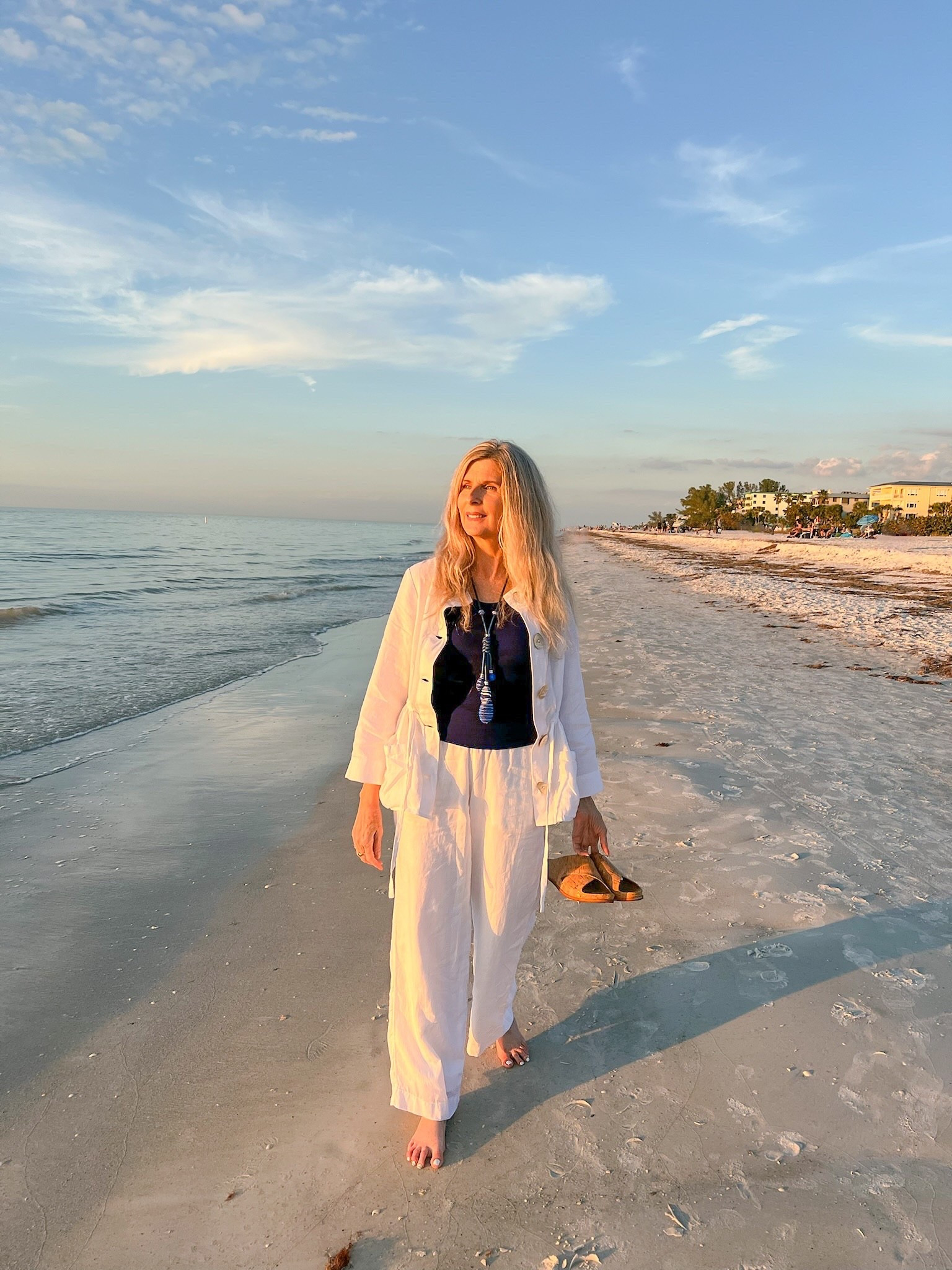 Transition to Early Spring outfit - perfect for every day or upcoming travel plans! Resort wear - soft layers, breathable fabrics, medium weight white linen wide leg pants with comfy waistband & pockets, matching jacket - wear open with navy ribbed tank top or buttoned. Jacket had front pockets & drawstring waist. Add in the ideal accessories - Navy drop necklace, & cork slides for an easy to pack weekend getaway. Also available in petite!

#LTKTravel #LTKgrwm #LTKSeasonal