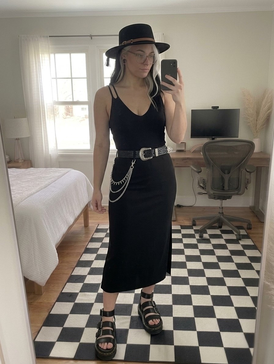 Goth-inspired details meet a sleek silhouette in this monochromatic look. This high-waisted black midi skirt and V-neck tank combo is the perfect base for statement accessories. I’ve styled it with a wide-brim boater hat and an embossed leather belt for a western-gothic fusion. Complete the vibe with platform gladiator sandals. They are the ultimate summer staple for that cool girl aesthetic.

#LTKootd #LTKSeasonal #LTKMidsize