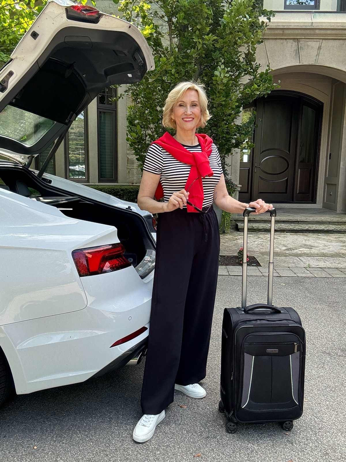 My kind of travel outfit: comfortable, but still looks like I made an effort. ✈️🤍

A classic striped tee, flowy pants and sneakers keep things easy and comfy for travelling, while the red sweatshirt tied around the shoulders adds a little pop of colour. I also love having a sweatshirt with me for chilly airports or the plane!

#LTKTravel #LTKSeasonal #LTKOver40