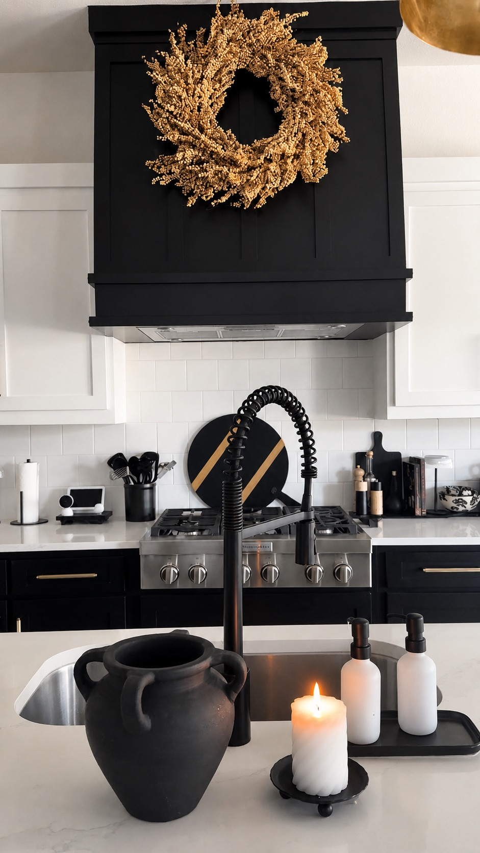 Slowly layering in the fall details 🍂 This warm, textured wreath was the perfect seasonal touch for my black range hood while keeping the kitchen modern, neutral, and minimal. 

#LTKHome #LTKSeasonal #LTKFinds #FallKitchenDecor #ModernFallDecor #NeutralFallDecor #FallHomeDecor #KitchenDecor #CozyHomeDecor #BlackAndWhiteKitchen #FallDecorInspo #ModernHomeStyle

#LTKSeasonal #LTKHome