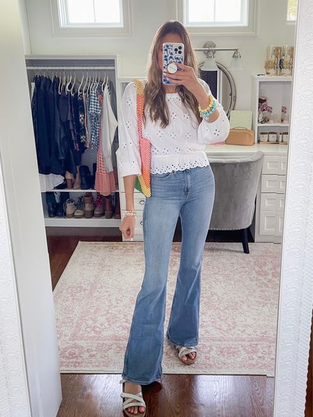 Spring outfit / summer outfit 
Eyelet top 
Statement bag
Rainbow beaded bag
Flare jeans 
Flares 
Hudson jeans 
White blouse 

#LTKSeasonal #LTKstyletip #LTKitbag