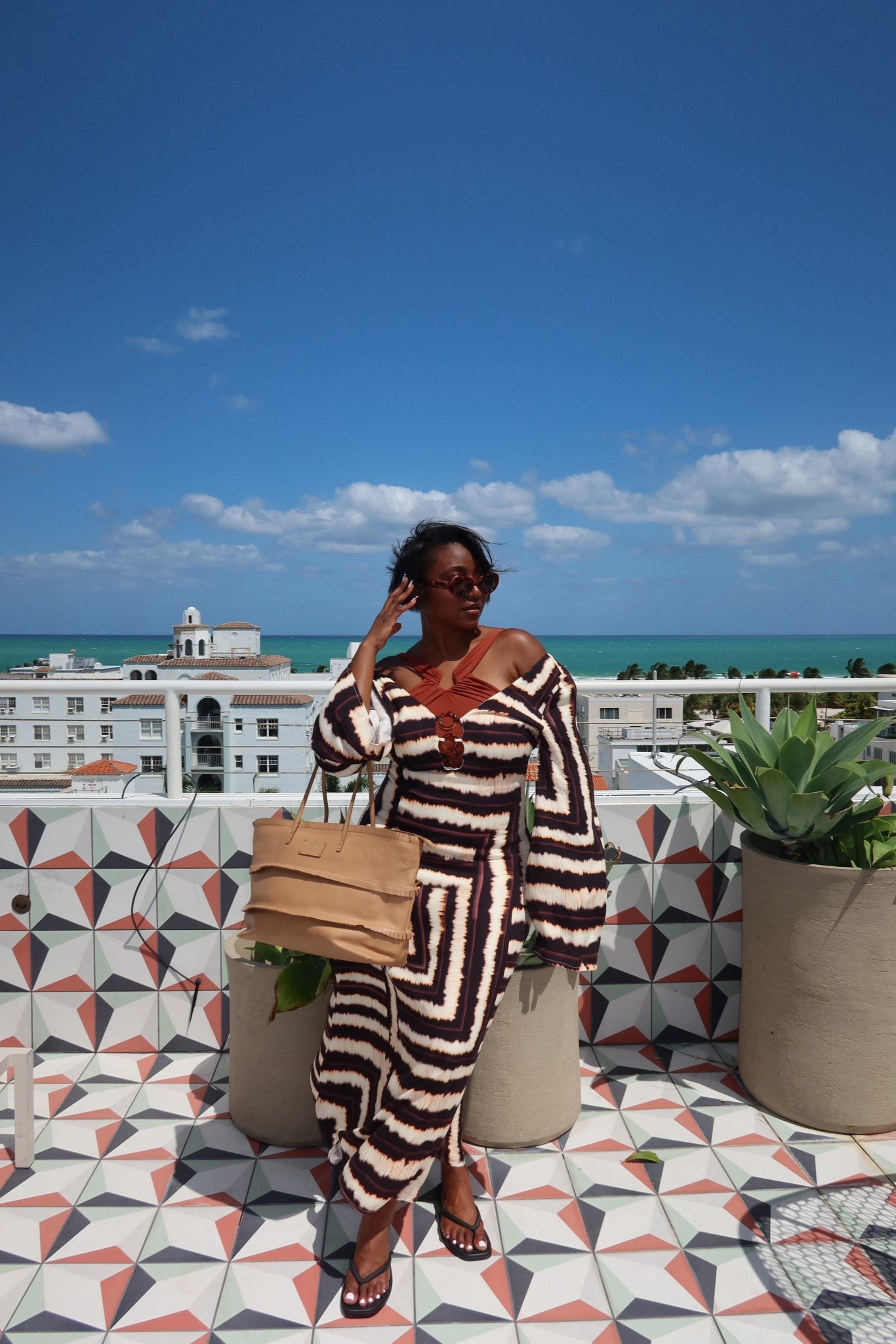 A chic but modest coverup! I’m wearing one of my favorite bathing suits and this beautiful light weight dress from @petalandpup! I got a size L and it fits perfectly. #modeststyle #modestoutfits #modestvacationlooks 