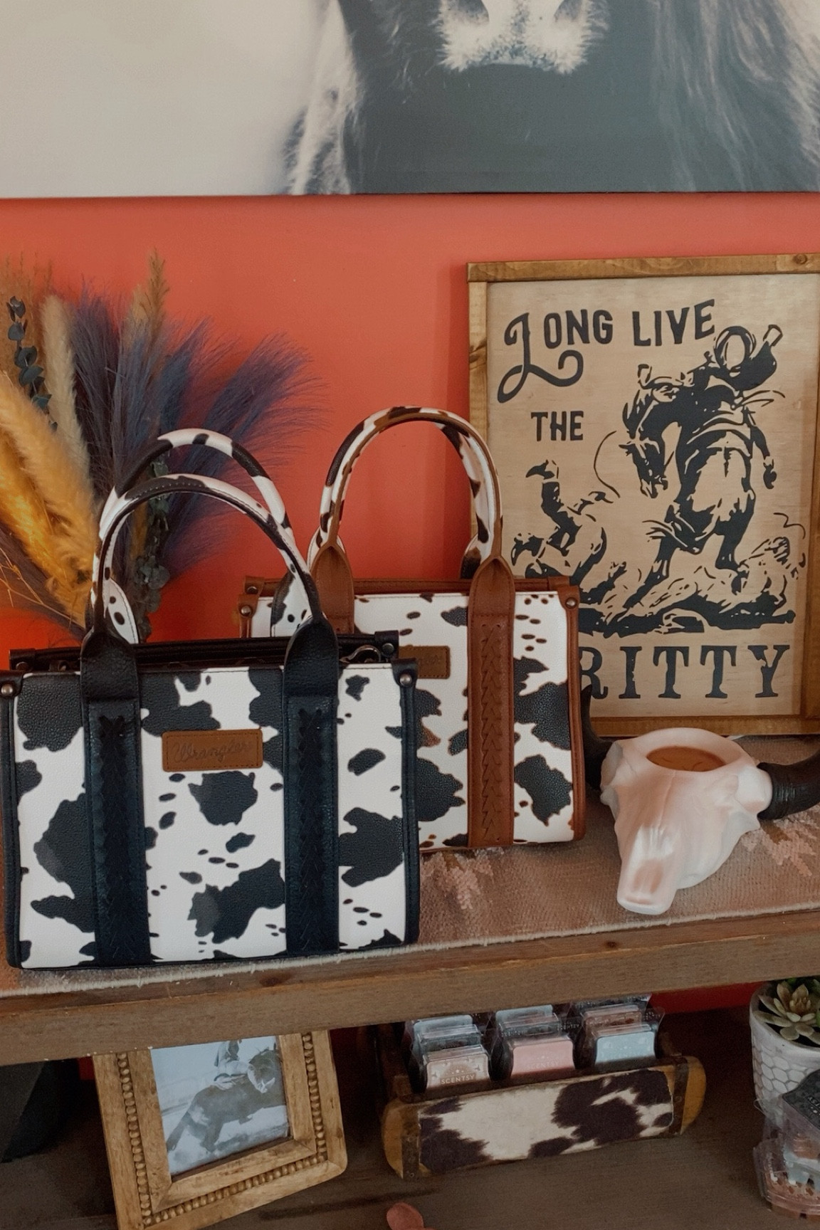 I'm obsessed with these cow print Wrangler Bags!!! 

#LTKItBag