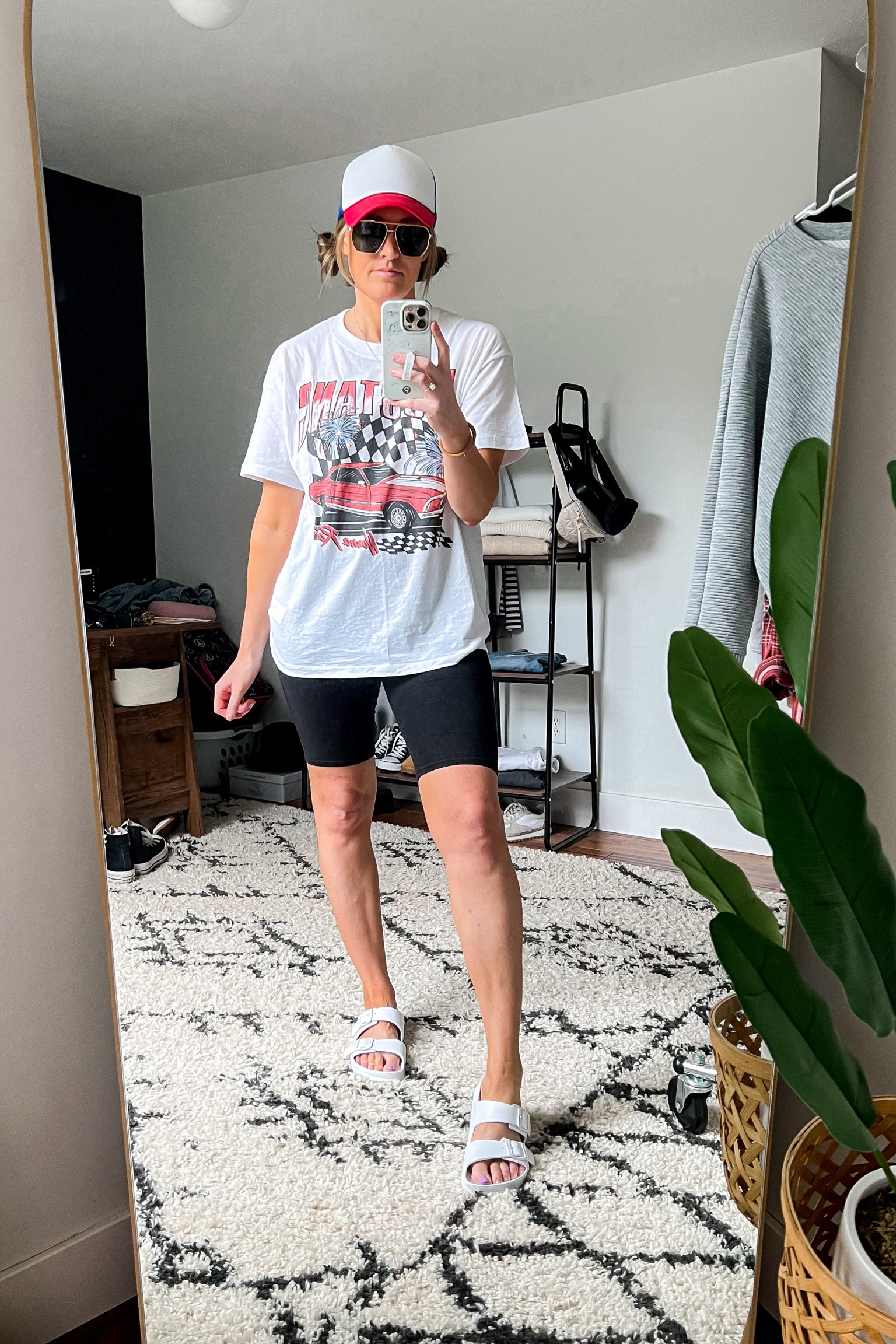 Fourth of July outfit. Patriotic outfit. Americana. Outfit of the day. Graphic tee. Bike shorts. Trucker hat. White slide sandals. 

#LTKunder50 #LTKunder100 #LTKSeasonal