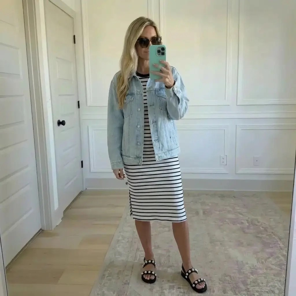 Soft morning light spills across white paneled walls as effortless stripes meet worn-in denim. A classic black-and-white midi dress anchors the look—clean, timeless, unfussy—layered with a light-wash denim jacket that feels casually confident, like a coffee run that turns into a full day out. Studded black sandals ground the outfit with a hint of edge, balancing polish and ease. It’s the kind of look that works anywhere—errands, travel days, brunch dates—quietly chic, comfortable, and always pulled together. ✨

Hashtags

#TrendyHeidi
#TrendyWithAPassport
#EverydayStyle
#EffortlessChic
#CasualClassic
#DenimLayering
#StripeStyle
#MidiDressStyle
#NeutralOutfit
#ModernMinimal
#WeekendWear
#TravelStyle
#CapsuleWardrobe
#MomStyleButMakeItChic
#PolishedCasual
#OOTD
#StyleInspo
#SimpleOutfits
#ClassicWithEdge
#LaidBackLuxury


#LTKdayinmylife #LTKValentine #LTKgrwm