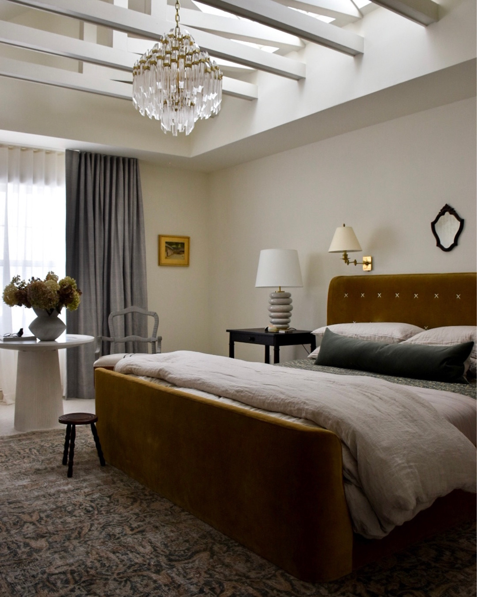 Traditional bedroom, high end bedroom, primary bedroom, velvet bed, lamps, white table, crystal chandelier, velvet bed, vintage rug

#LTKhome #LTKSale