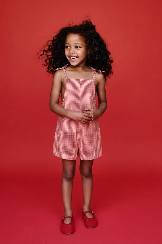 Playsuit with a straight neckline and straps with a bow appliqué. Press stud fastening at the ba... | Zara UK