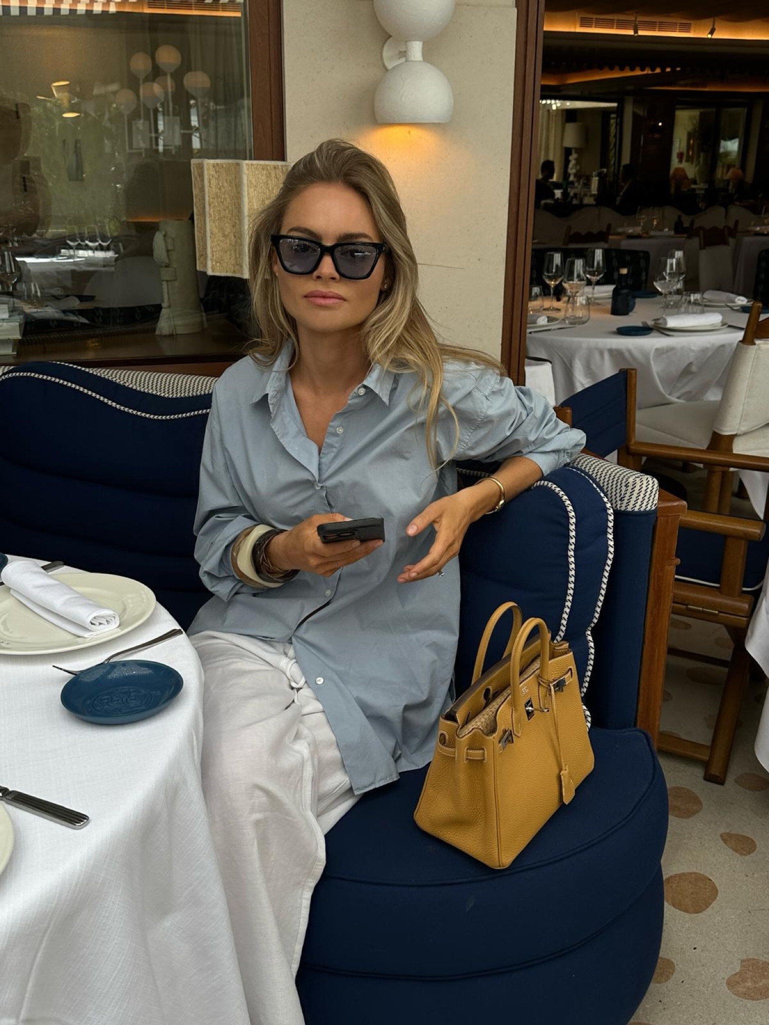 Blue oxford shirt, white linen trousers, mustard yellow Birkin 30, chunky resin bracelets bangles, city break outfit, spring, summerr

#LTKspring #LTKeurope #LTKuk
