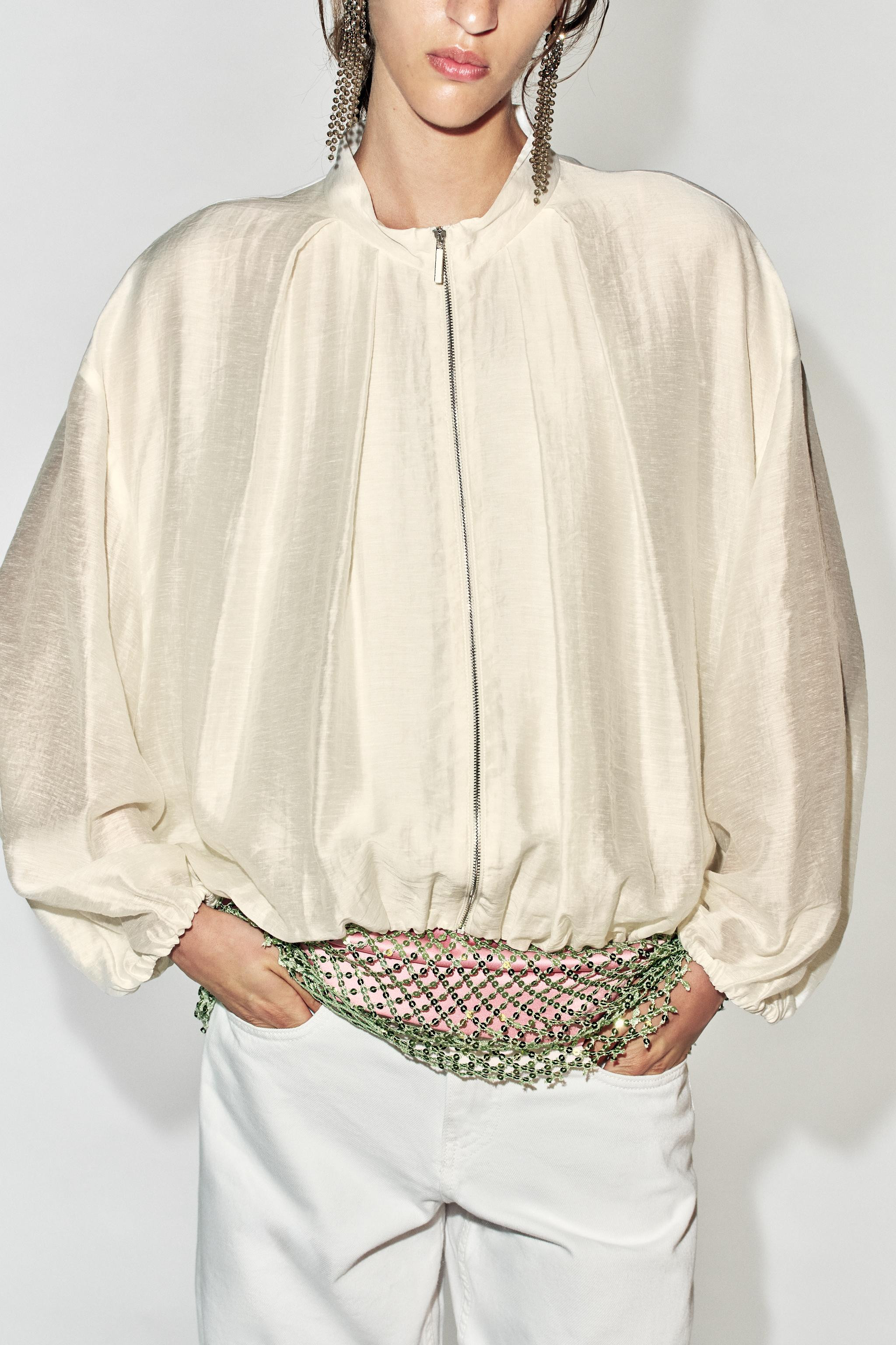 Long-sleeve jacket with a mock neck. Features concealed side seam pockets, elasticized finishes, ... | Zara US