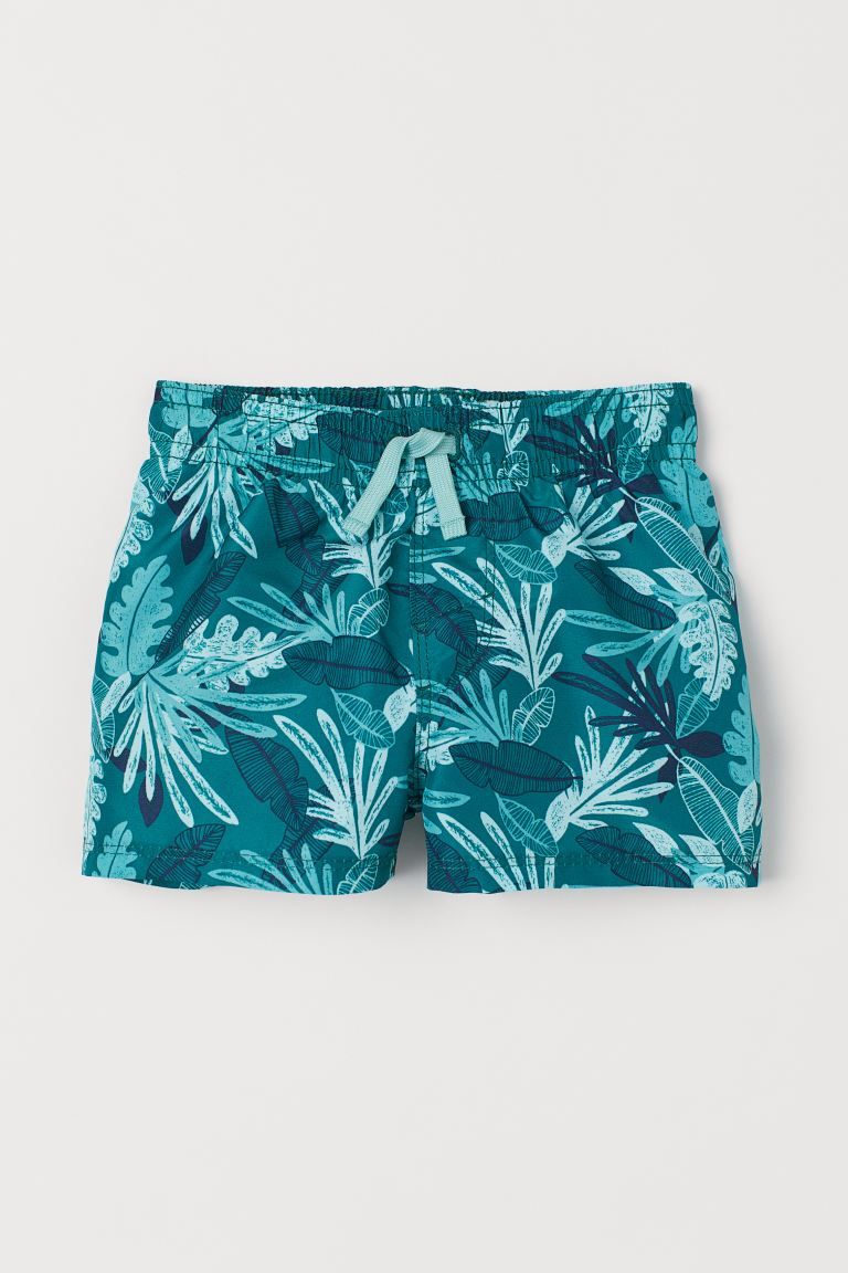 Swim shorts with a printed pattern. Elasticized waistband with drawstring and mock fly. Soft mesh... | H&M (US + CA)