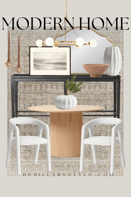 Modern Home: Neutral home decor and furniture finds for the modern organic dining room. Pedestal dining table, fluted table, white dining chairs, modern dining chairs, black console table, modern console, brass and white chandelier, gold arched mirror, framed sketch art, paper mache vase, white vase, terracotta bowl, candle holders, faux stems, neutral area rug. Modern dining room, neutral dining, modern home. Target, West Elm, Wayfair, McGee & Co, H&M.  

#LTKHome #LTKStyleTip #LTKSeasonal