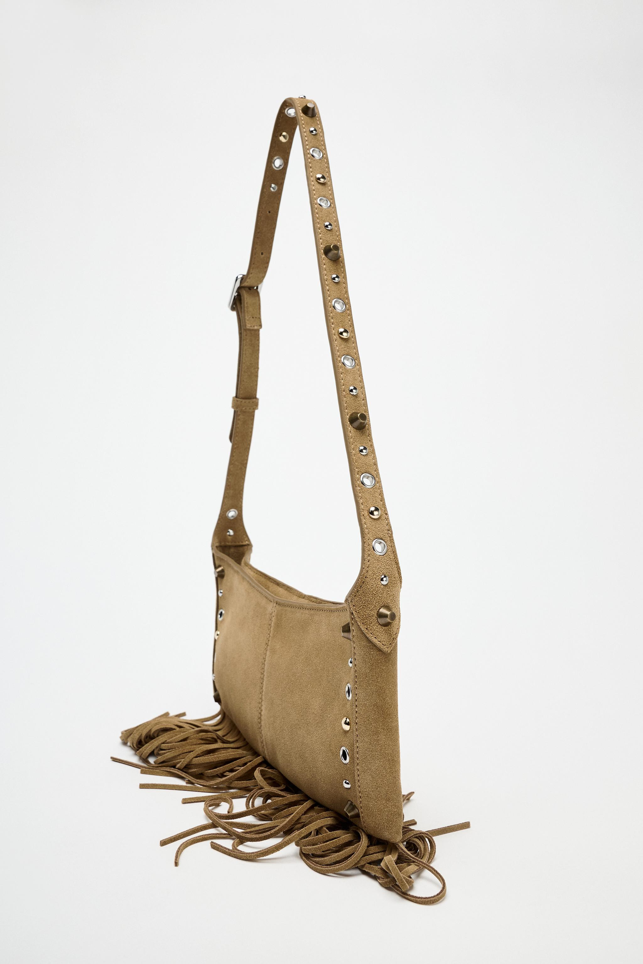 Suede shoulder bag. Fringed trim. Stud and grommet detail on the body and strap. Interior zip poc... | Zara US