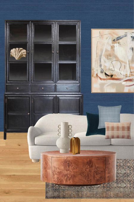 Eclectic modern living room with navy blue walls, brown and copper accents. Mixing new furniture with vintage inspired home decor. 

#LTKhome #LTKFind