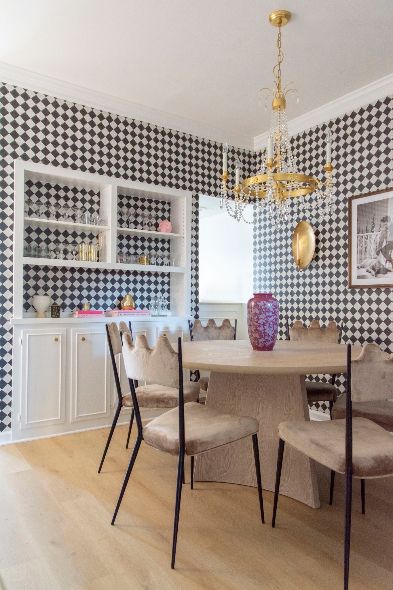 Retro glam dining room with peel and stick checkered removable wallpaper, black checkerboard pattern wallpaper, modern dining table, squiggle dining chairs, Crystorama crystal chandelier 

#LTKHome #LTKStyleTip