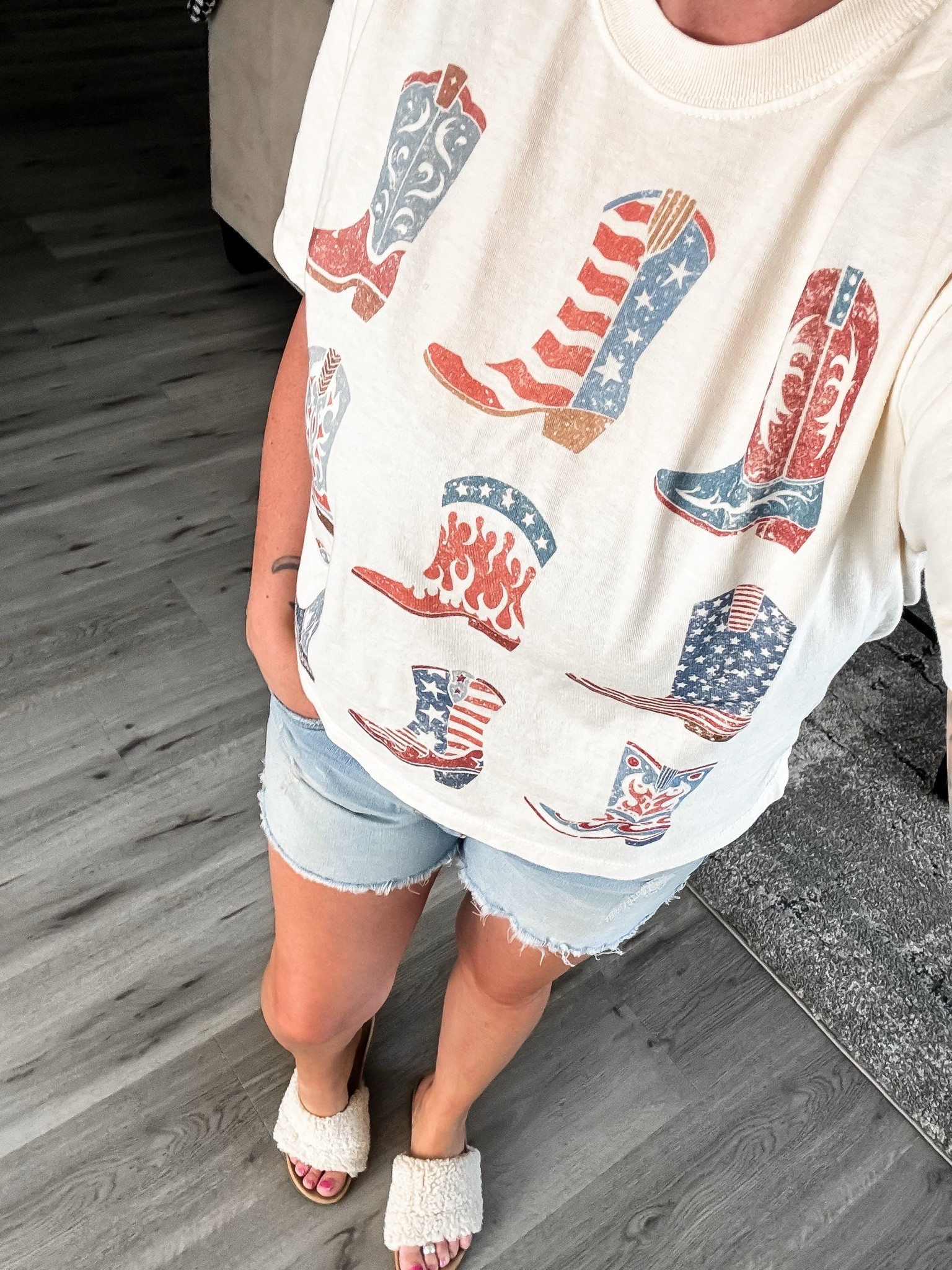 Saddle up for summer in this adorable patriotic graphic tee! Featuring a fun mix of vintage-inspired cowboy boots and hats with classic red, white, and blue details, this oversized tee is the perfect blend of western charm and Americana style. Pair it with your favorite denim shorts, jeans, or leggings for backyard BBQs, fireworks, rodeos, country concerts, Memorial Day, and all your Fourth of July celebrations. Comfortable, casual, and effortlessly cute—this is the kind of graphic tee you’ll reach for all season long! ❤️🤍💙
I got a size M for larger chest, but could have done a small.

#PatrioticStyle #FourthOfJulyOutfit #AmericanaStyle #WesternFashion #CowgirlStyle #CountryConcertOutfit #SummerStyle #GraphicTeeLove #RedWhiteAndBlue #USAStyle #PatrioticOutfit #MemorialDayStyle #CowboyBoots #WesternChic #CasualSummerOutfit #SummerFashionFinds #LTKFashion #LTKStyle #LTKSummer #WeekendStyle #CountryGirlStyle #TrendyGraphicTees #OOTDInspiration #ShopTheLook #ViralFashionFinds

patriotic graphic tee • patriotic t shirt women • 4th of july shirt • americana graphic tee • western patriotic shirt • cowboy boots graphic tee • patriotic western outfit • red white and blue shirt • memorial day outfit • fourth of july outfit women • country concert outfit • cowgirl graphic tee • western fashion women • oversized patriotic tee • summer graphic tee • casual summer outfit • trendy patriotic clothing • americana fashion • western style shirt • rodeo outfit women • country girl fashion • patriotic boutique clothing • cute graphic tees for women • holiday weekend outfit • july 4th apparel
@Mountain Moverz

#LTKootd #LTKOver40 #LTKvlog
