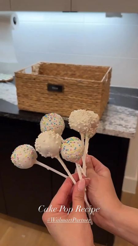 I’m so excited to team up with Walmart to share a yummy cake pop recipe I made for Kaiyen!! We have the Walmart+ InHome membership and with that added service, a trusted Walmart associate actually delivers your groceries to your garage, fridge, or pantry! It’s so convenient! They also can take your Walmart returns for you too!! Here are the cake pop ingredients you need:

•Vanilla cake mix
•3 eggs
•Water
•Vegetable oil
•Vanilla extract
•Powdered sugar
•Vanilla frosting
•Candy melts
•Sprinkles

Steps:
1.follow cake mix instructions
2.once cake is baked, crumble that up and put it into your mixer
3.add a handful of powdered sugar, a a sprinkle of vanilla extract and 1 tbsp of vanilla frosting. Mix.
4.Once you got the consistency you want,  create the cake ball rounds.
5.Melt your candy melts.
6.Take the lollipop stick, dip a tiny bit on it and place it into the cake ball. This will bind the two together. Then place it in the freezer for 10 minutes.
7.After 10 minutes, go ahead and take the cake balls out and dip the whole thing in the melted white chocolate. Let the extra drip off then add your sprinkles. All done! 

#nextwithnita #nwnhome #walmart #walmartpartner #walmartplus #cakepoprecipe #cakepops #toddlermom #recipes @walmart #walmartplus #walmartpartner 

#LTKhome #LTKfindsunder50 #LTKkids