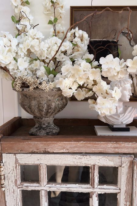 Shop my faux distressed concrete planter, and cherry blossom branches! 

#LTKhome #LTKSeasonal